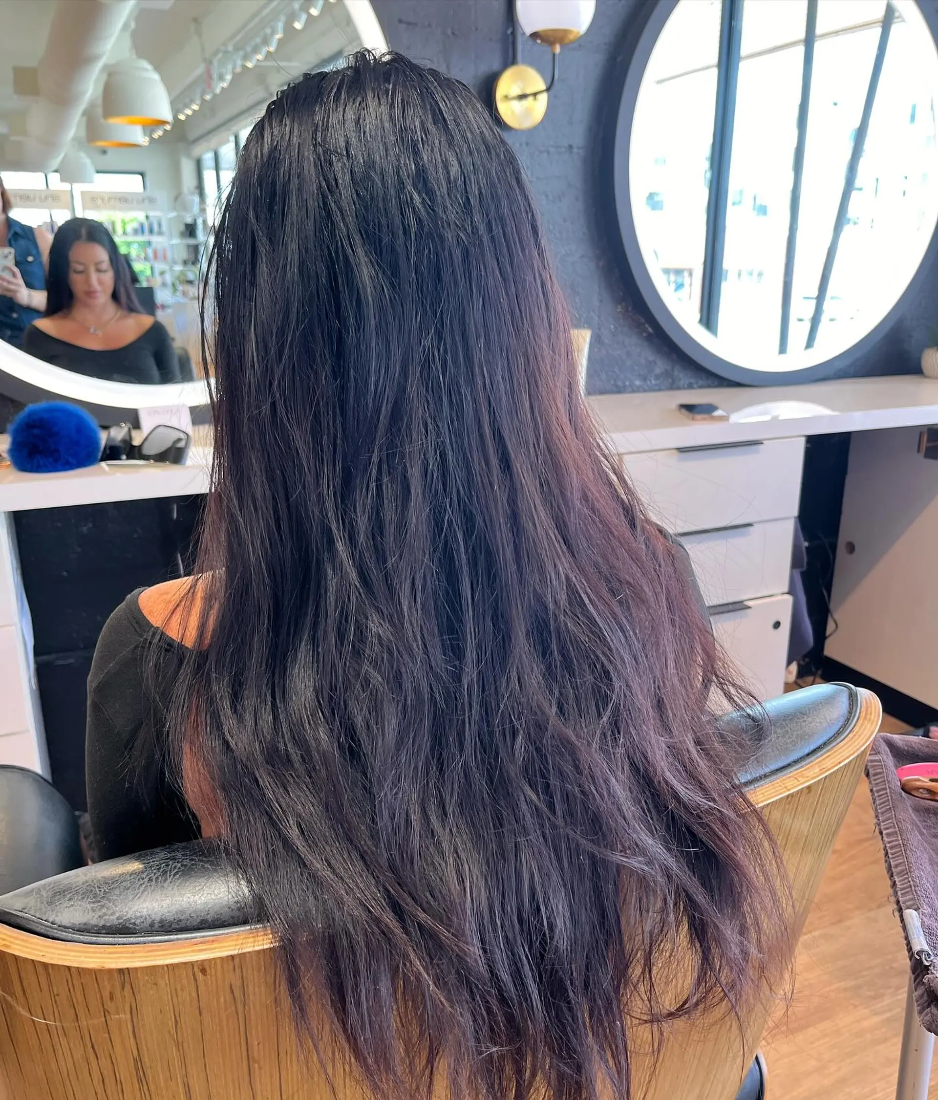 Extra-long midnight black hair styled straight with subtle natural texture, falling down the back. 1