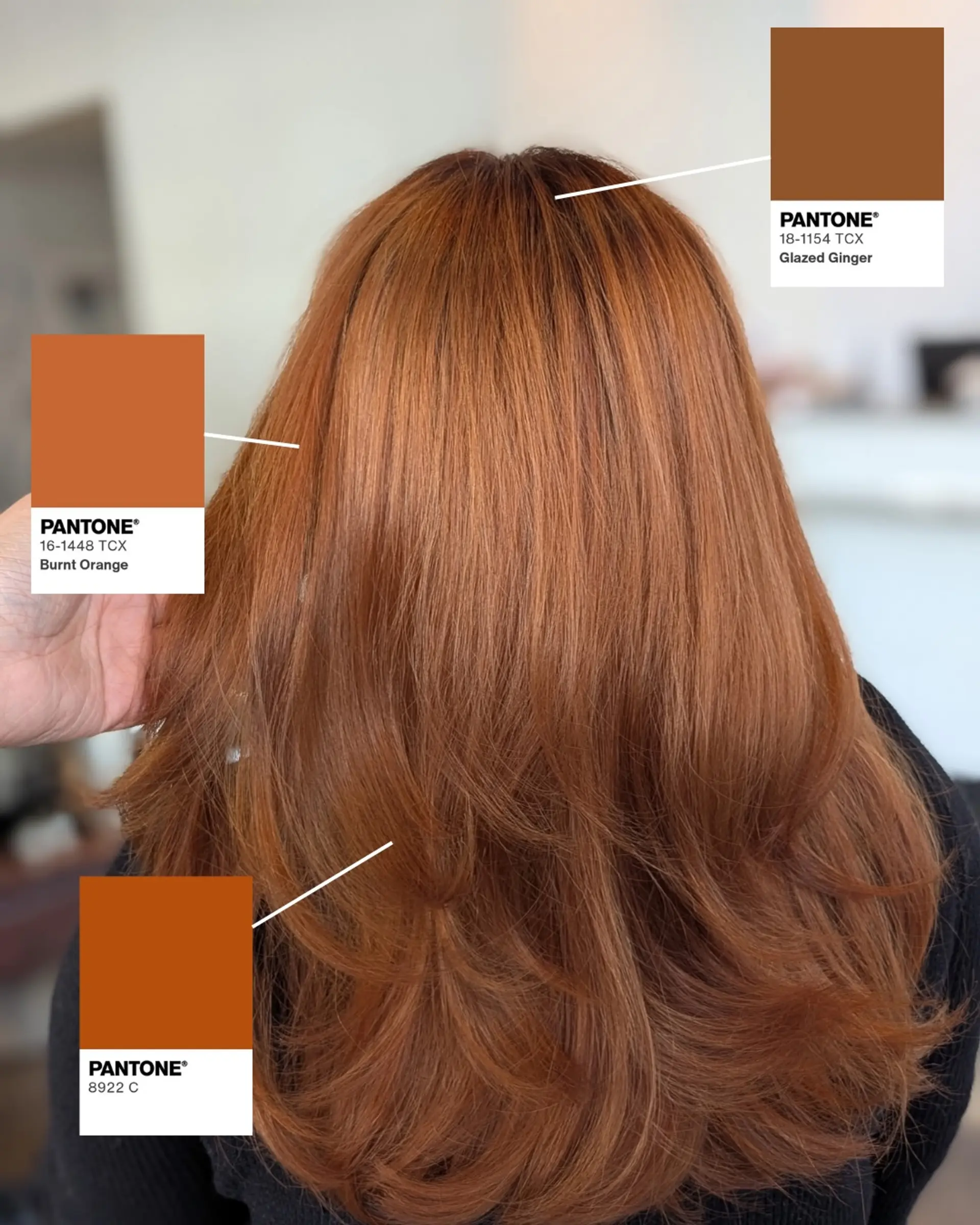 Medium-to-long vibrant copper hair styled with soft, voluminous layers and a bouncy blowout. 1