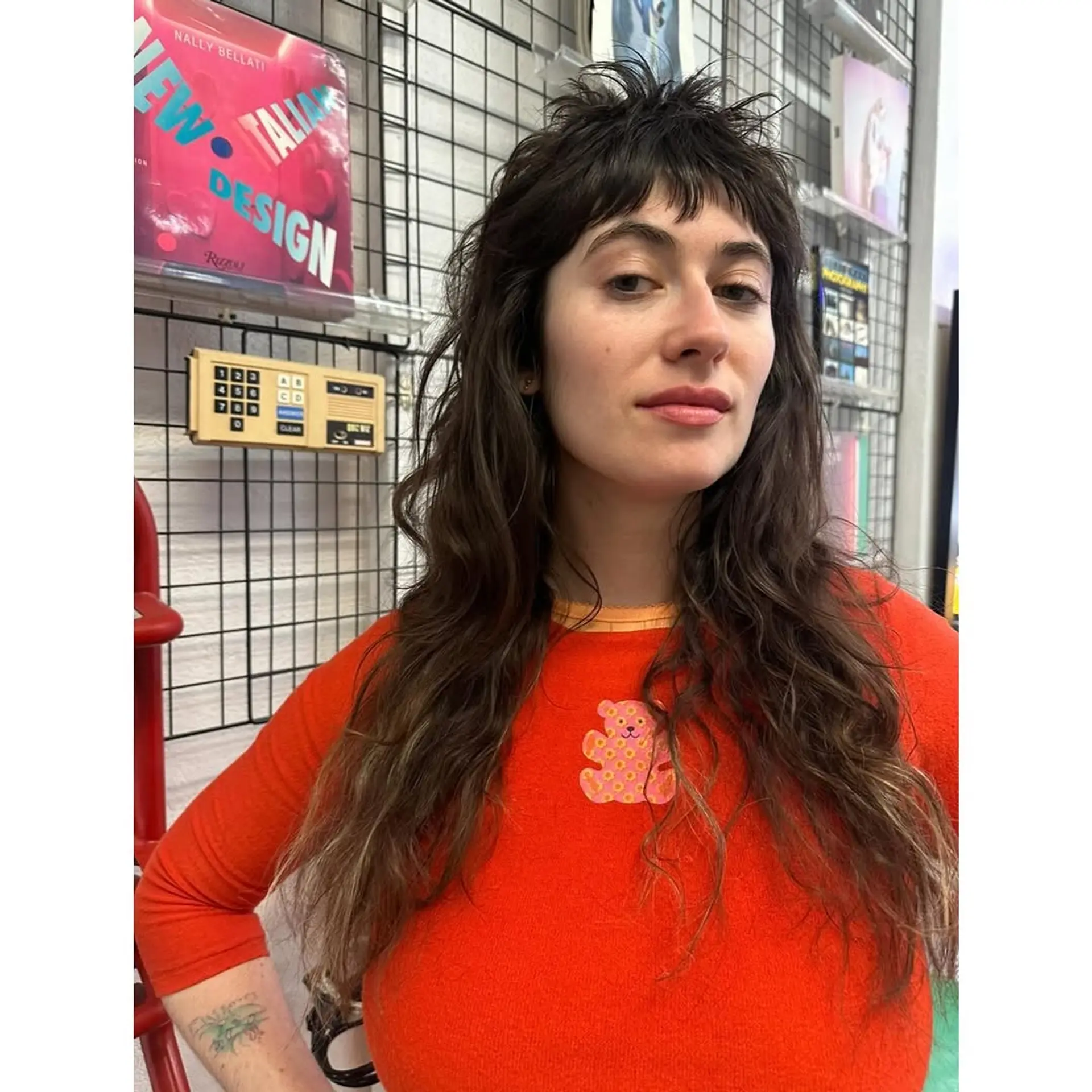 A modern, long-length shag cut characterized by choppy, internal layers, a voluminous crown, and textured, short bangs that transition into long, wavy lengths. 1