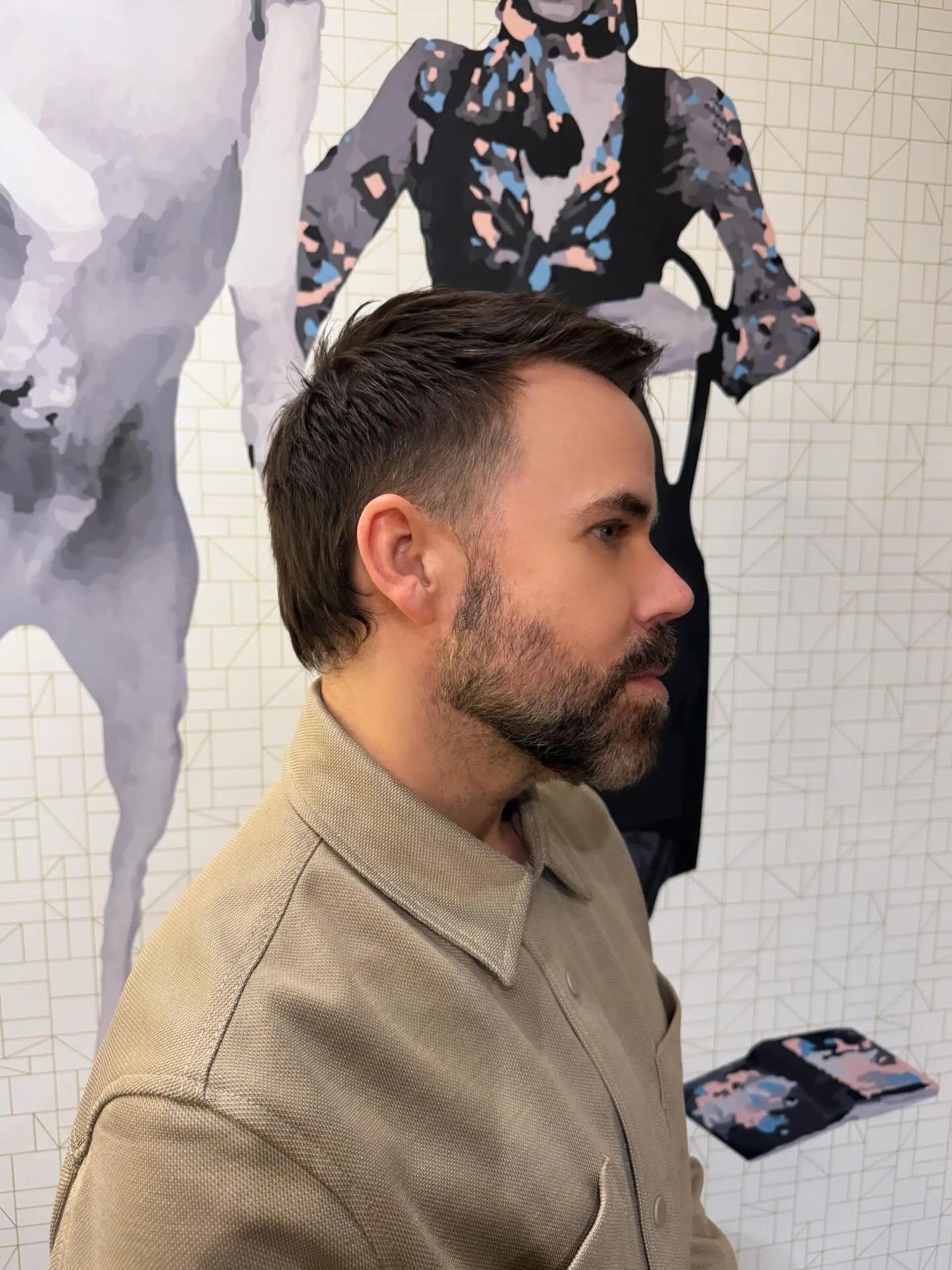 A modern textured haircut featuring faded temples, a cropped top, and a tapered length down the nape. 1