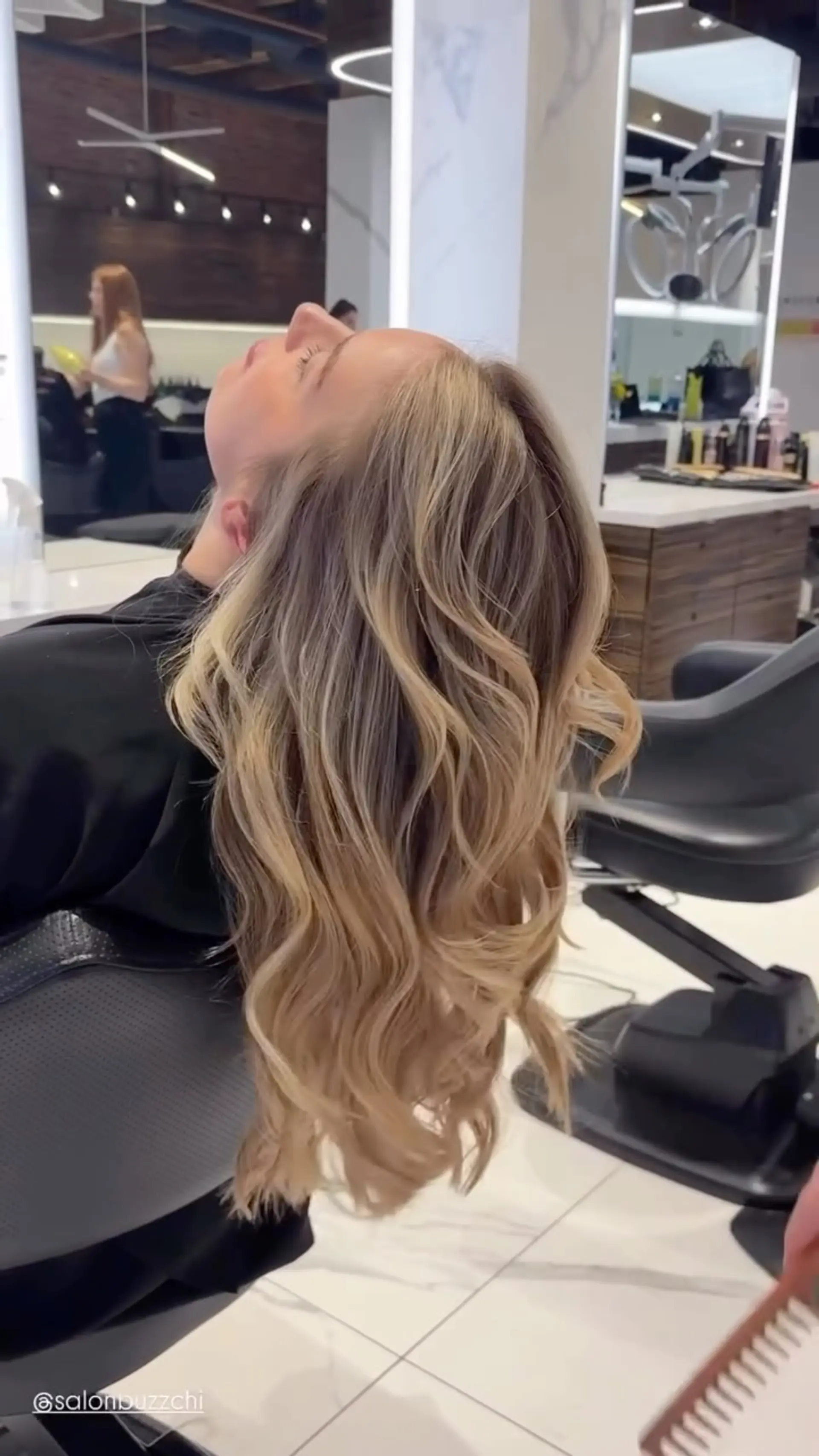 Long hair featuring blended blonde highlights styled into voluminous, loose flowing waves. 1
