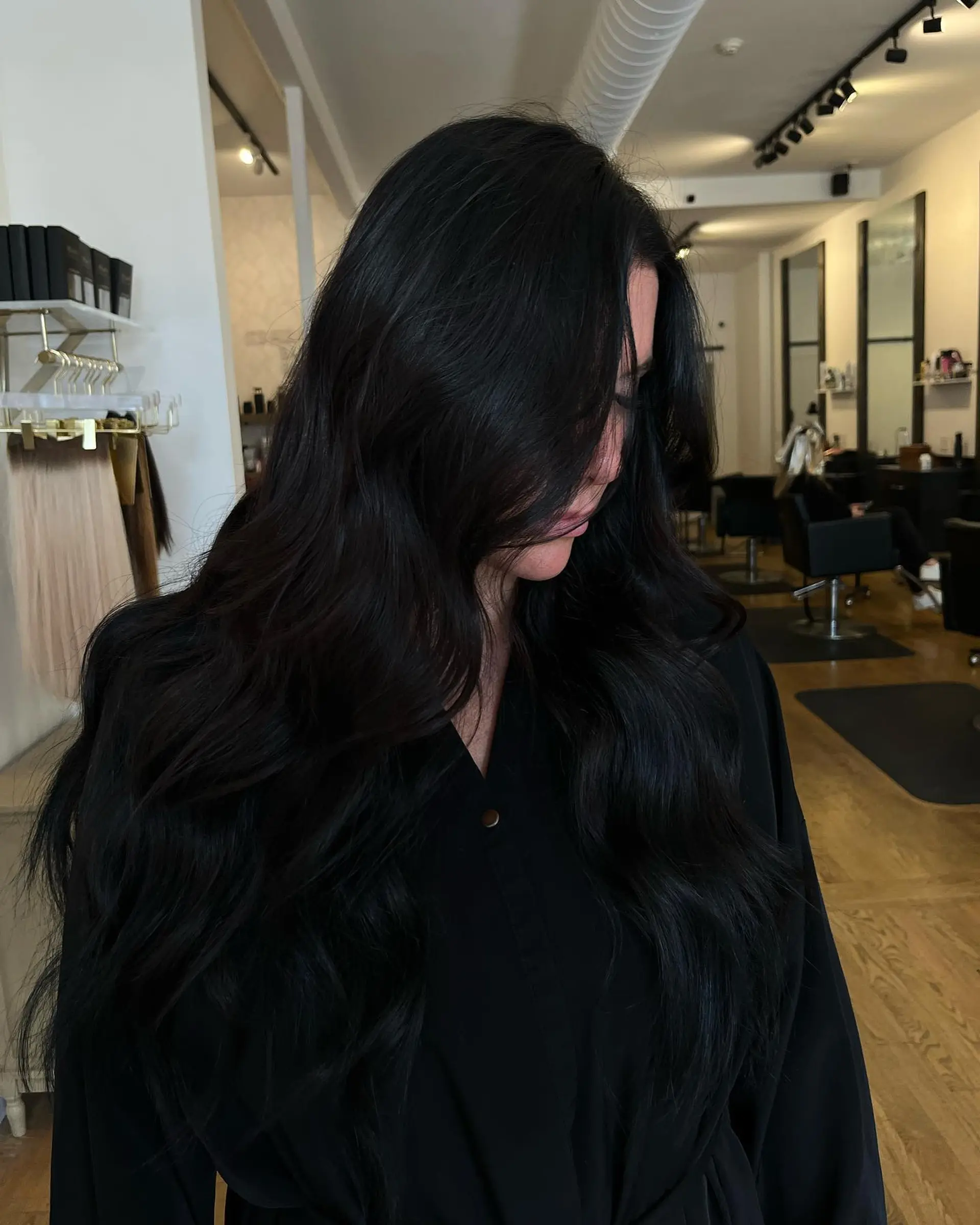 Ultra-long, rich jet black hair styled in smooth, flowing loose waves. 1