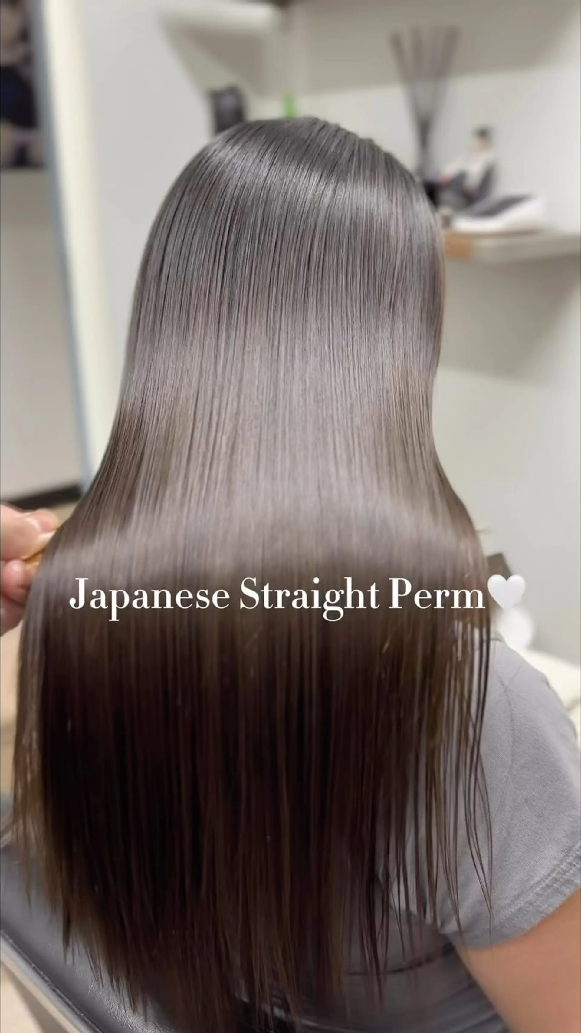 Ultra-sleek, pin-straight brunette hair with exceptional gloss and a smooth finish. 1