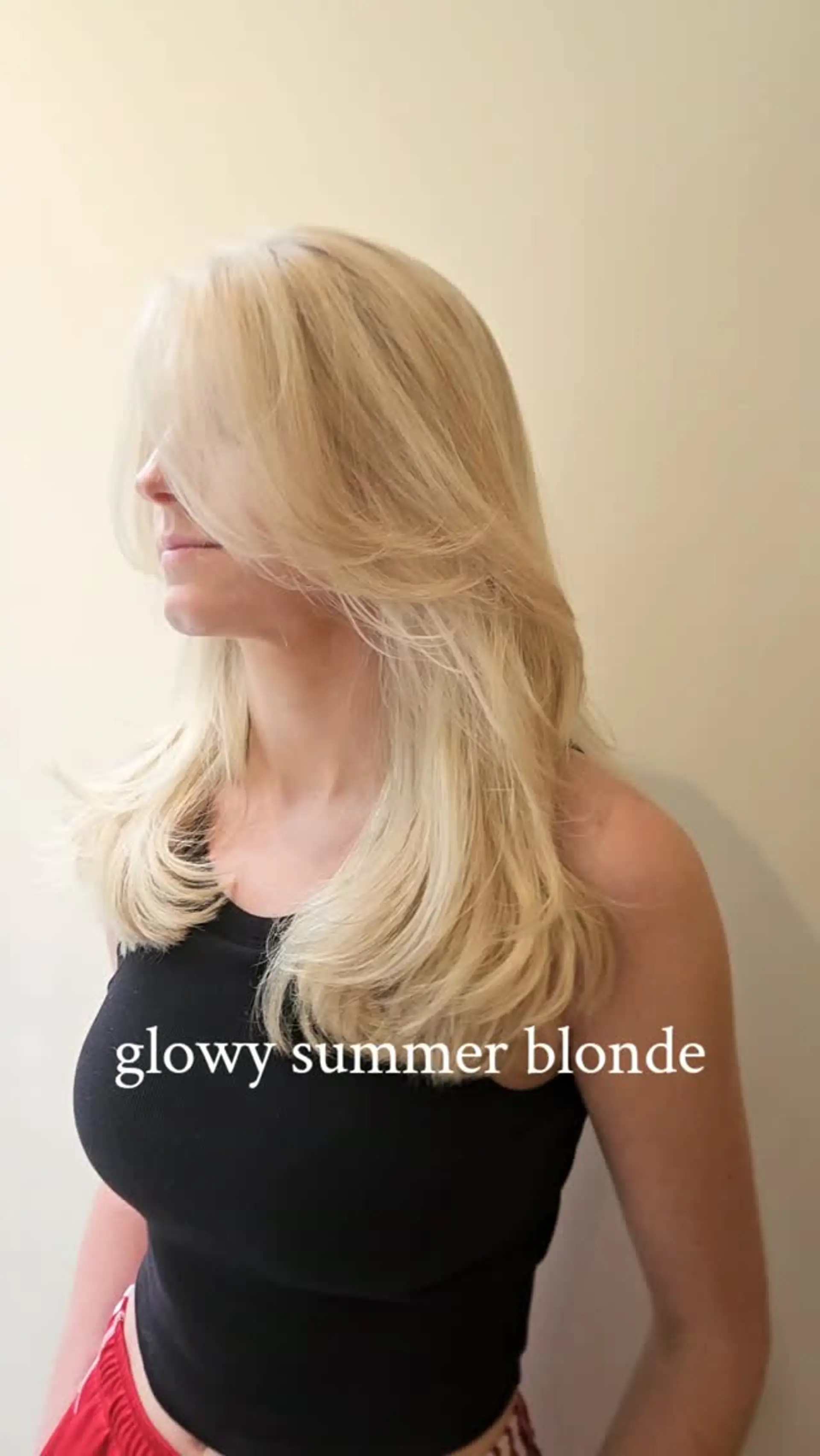 Luminous light blonde hair styled with face-framing feather layers and a smooth, voluminous blowout. 1