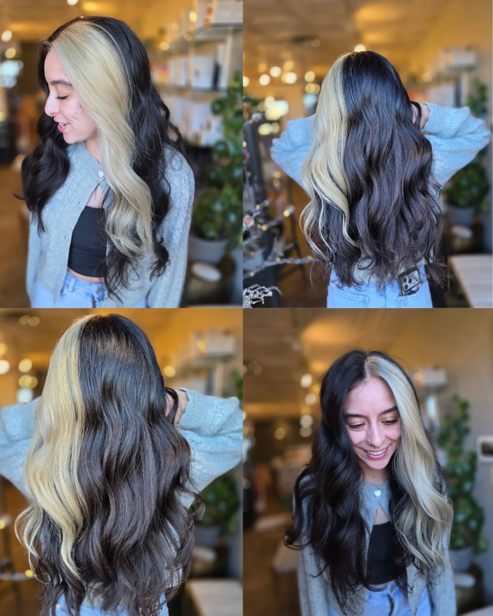 A bold split dye featuring jet black on one half and platinum blonde on the other, styled in soft, cascading waves with a clean center part. 1