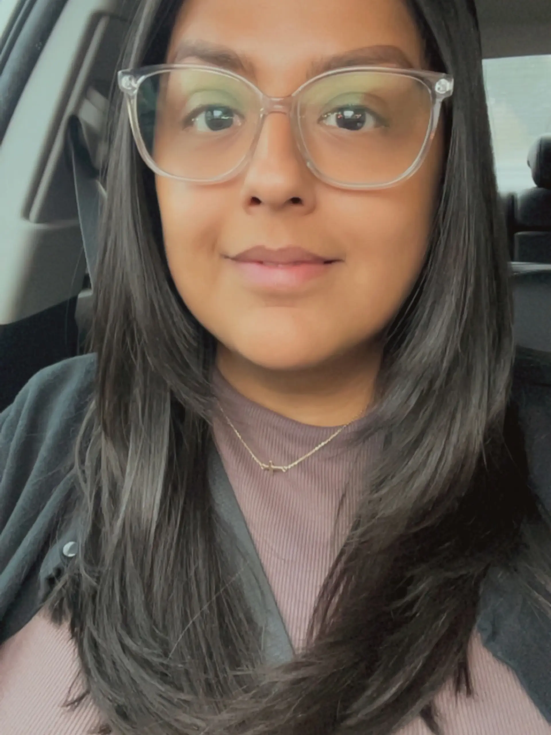 Long, dark hair styled with face-framing feathered layers and smoothly curved ends. 1