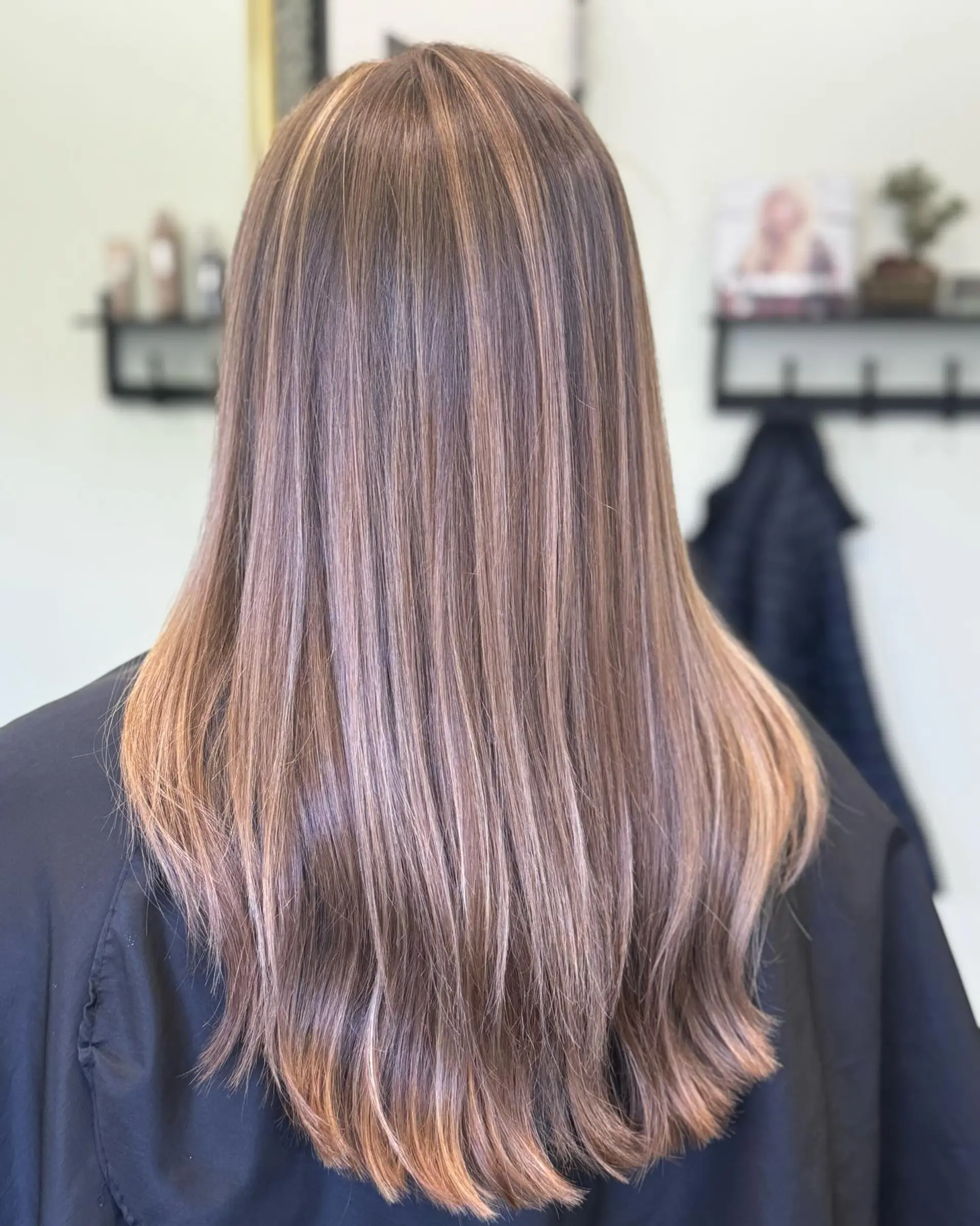 Long straight hair with seamless beige blonde highlights blended over a neutral light brown base, finished with soft layers at the ends. 1