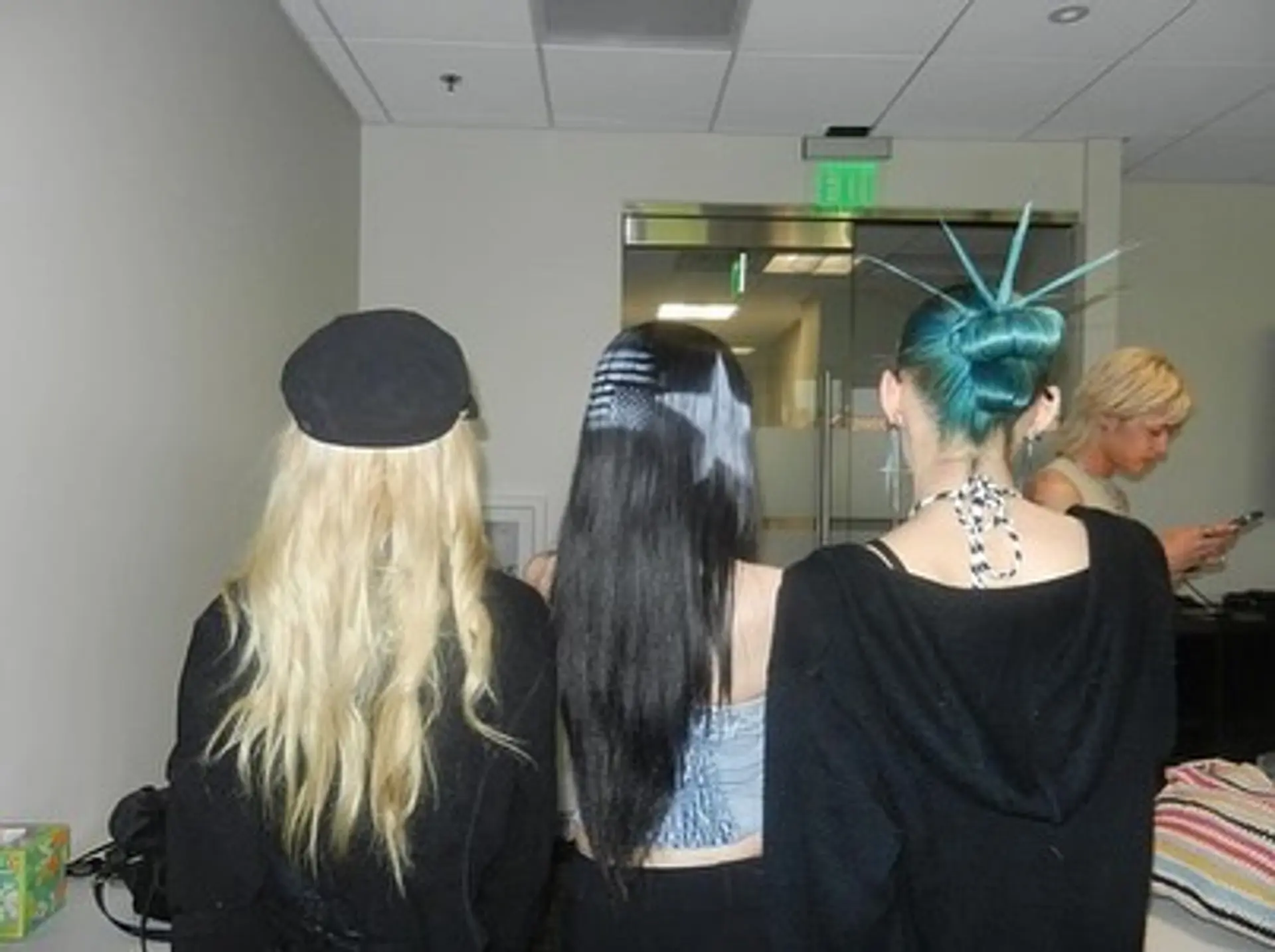 A trio of creative editorial hairstyles featuring textured blonde waves, stenciled star and stripe patterns on long straight dark hair, and a sculptural teal updo with spikes. 1