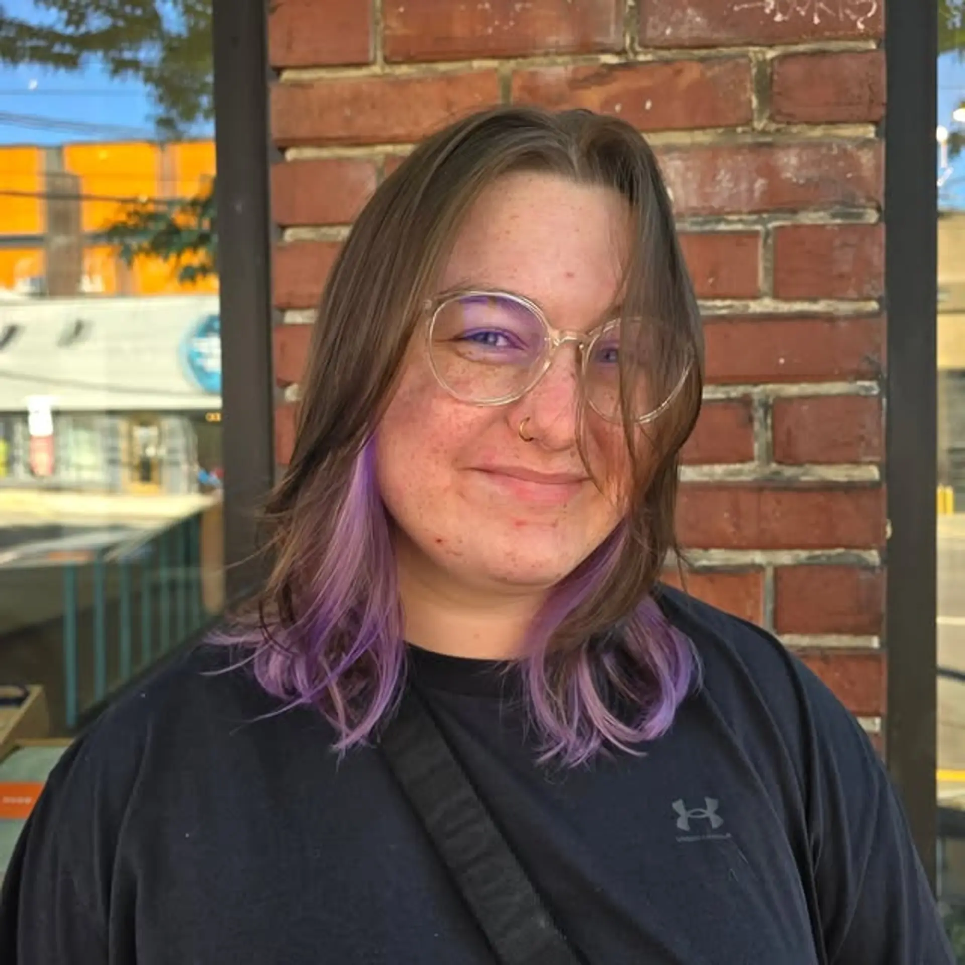 This medium-length style features soft layering and face-framing with eye-catching lavender highlights. 1