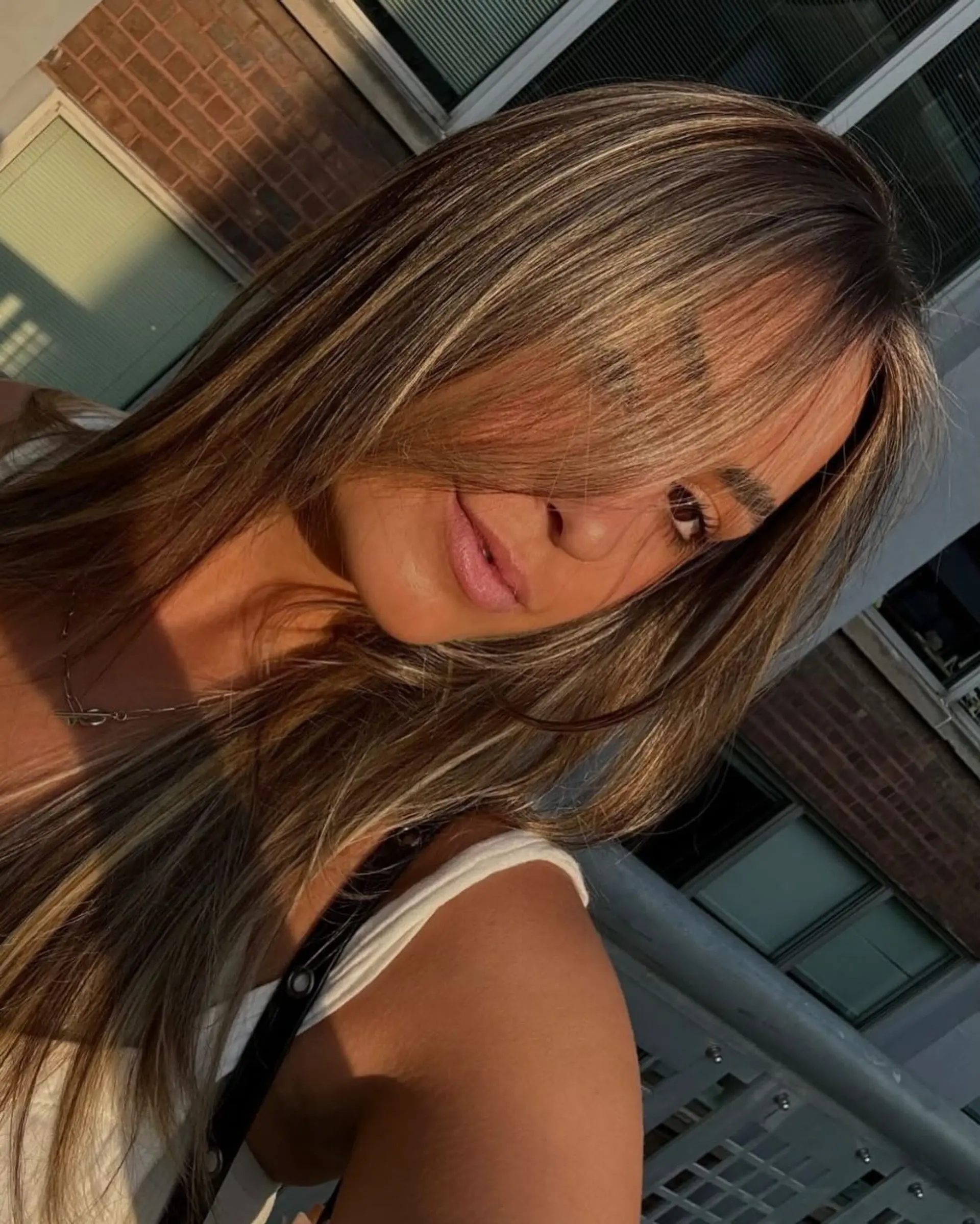 Long, layered hair with a bronde balayage. 1