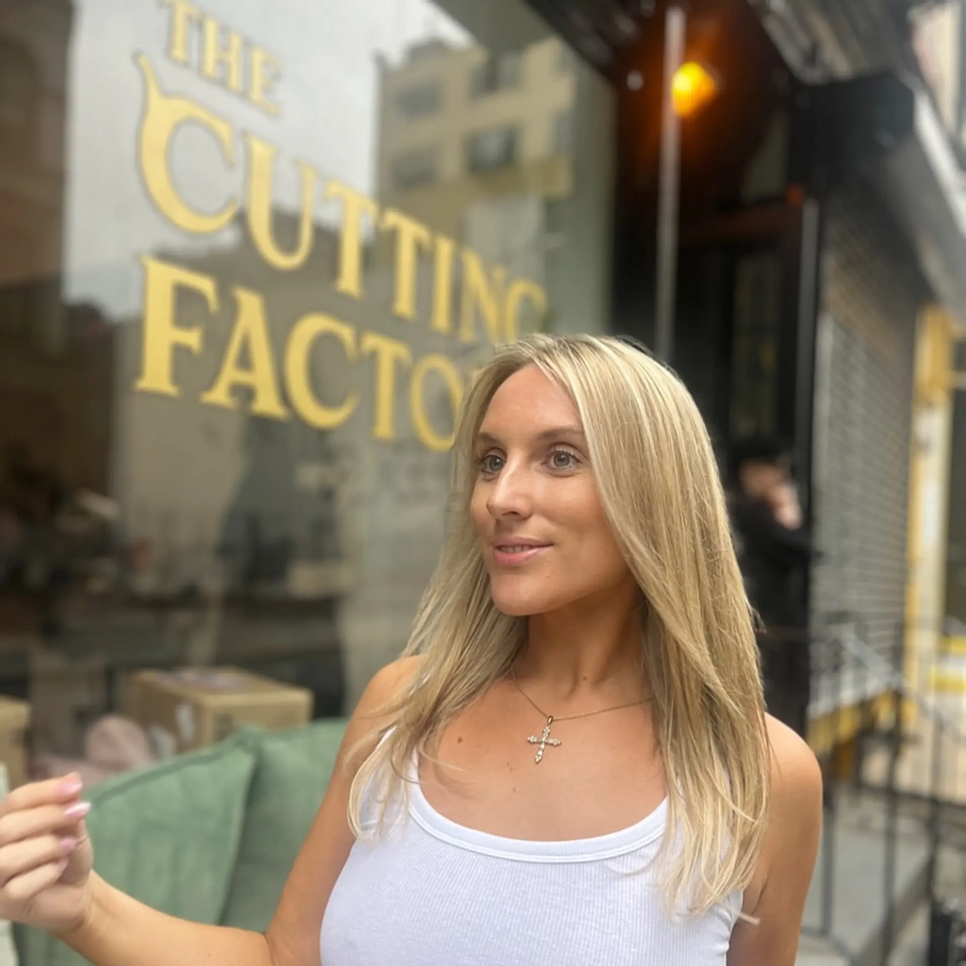 Long, straight, natural blonde hair with a middle part and layered, highlighted strands. 1