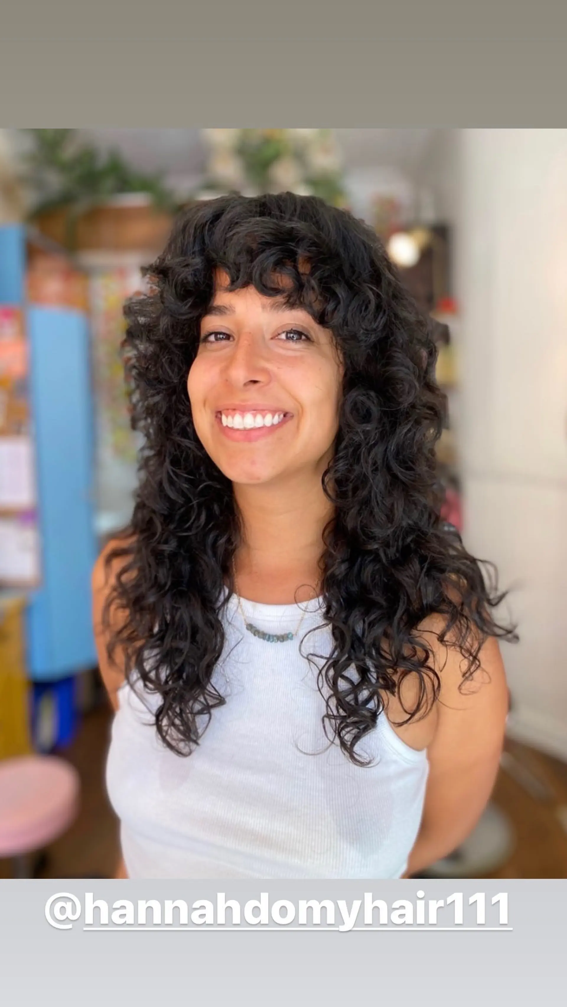 A long, curly shag with layered, fringed bangs. 1