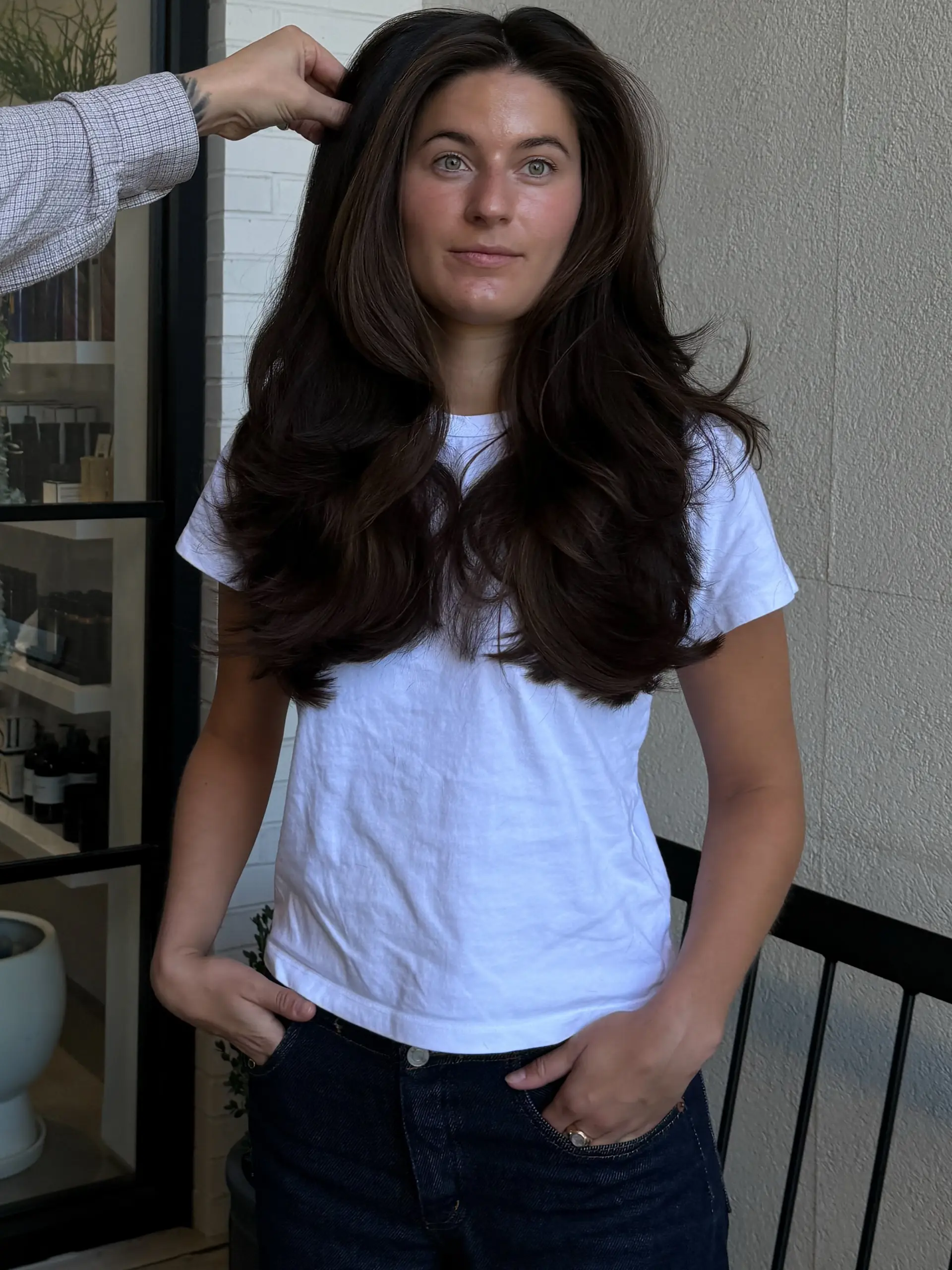 Voluminous dark brown long hair styled with soft face-framing layers and bouncy curved ends. 1