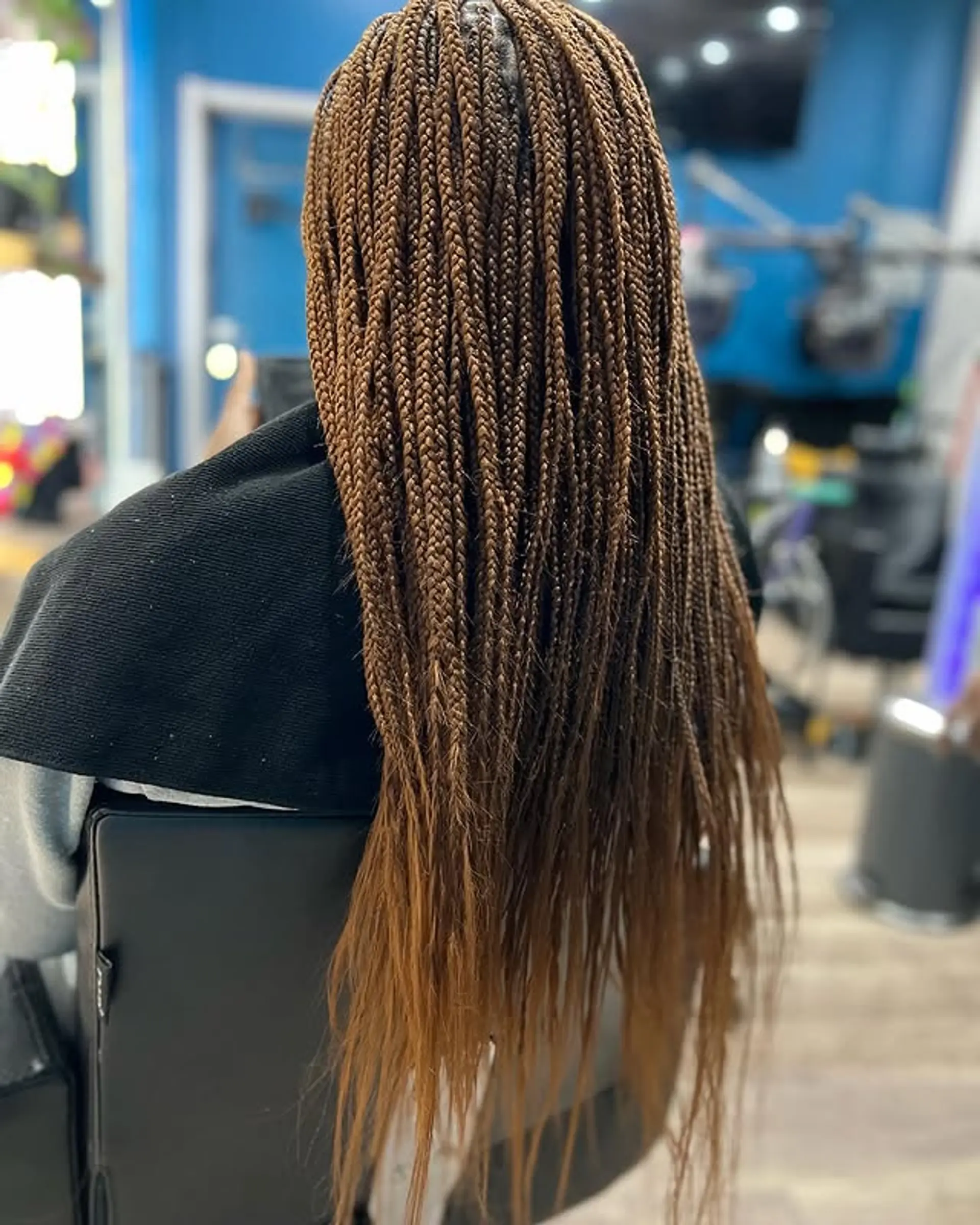 Long, knotless box braids with a bohemian touch. 1