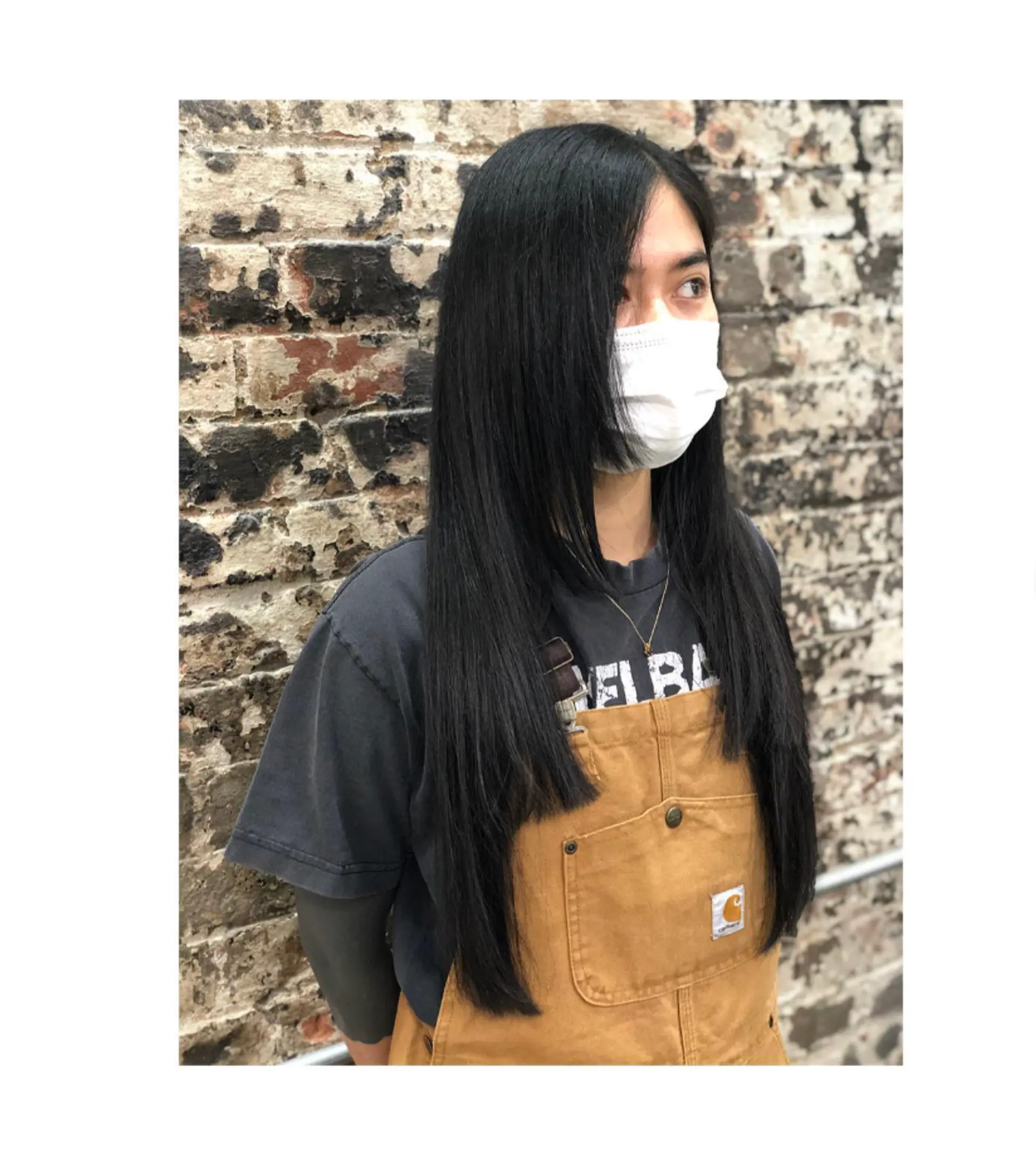 A long layered haircut with face-framing layers. 1