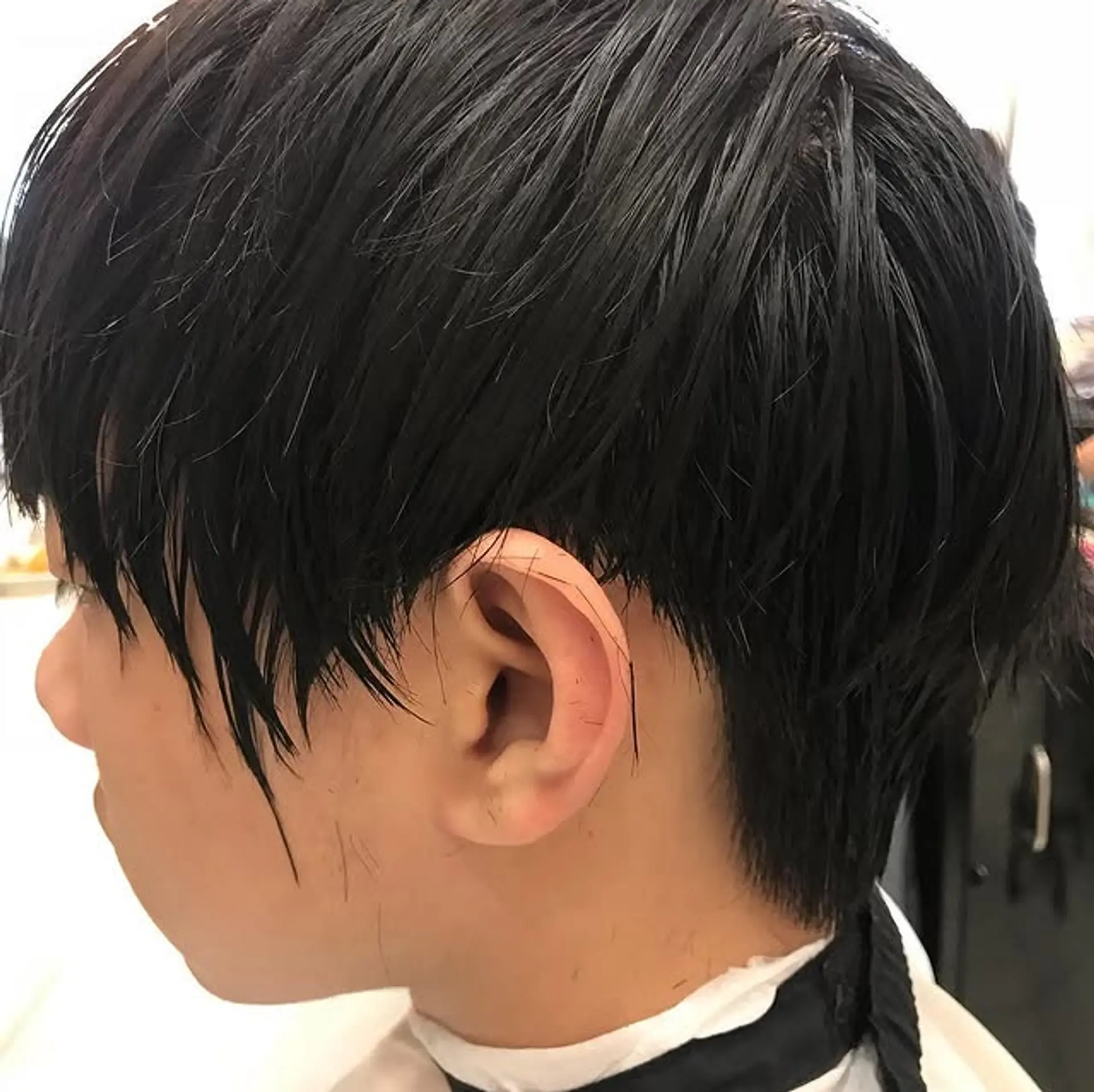 Features a blunt, textured fringe with tapered sides and back. 1