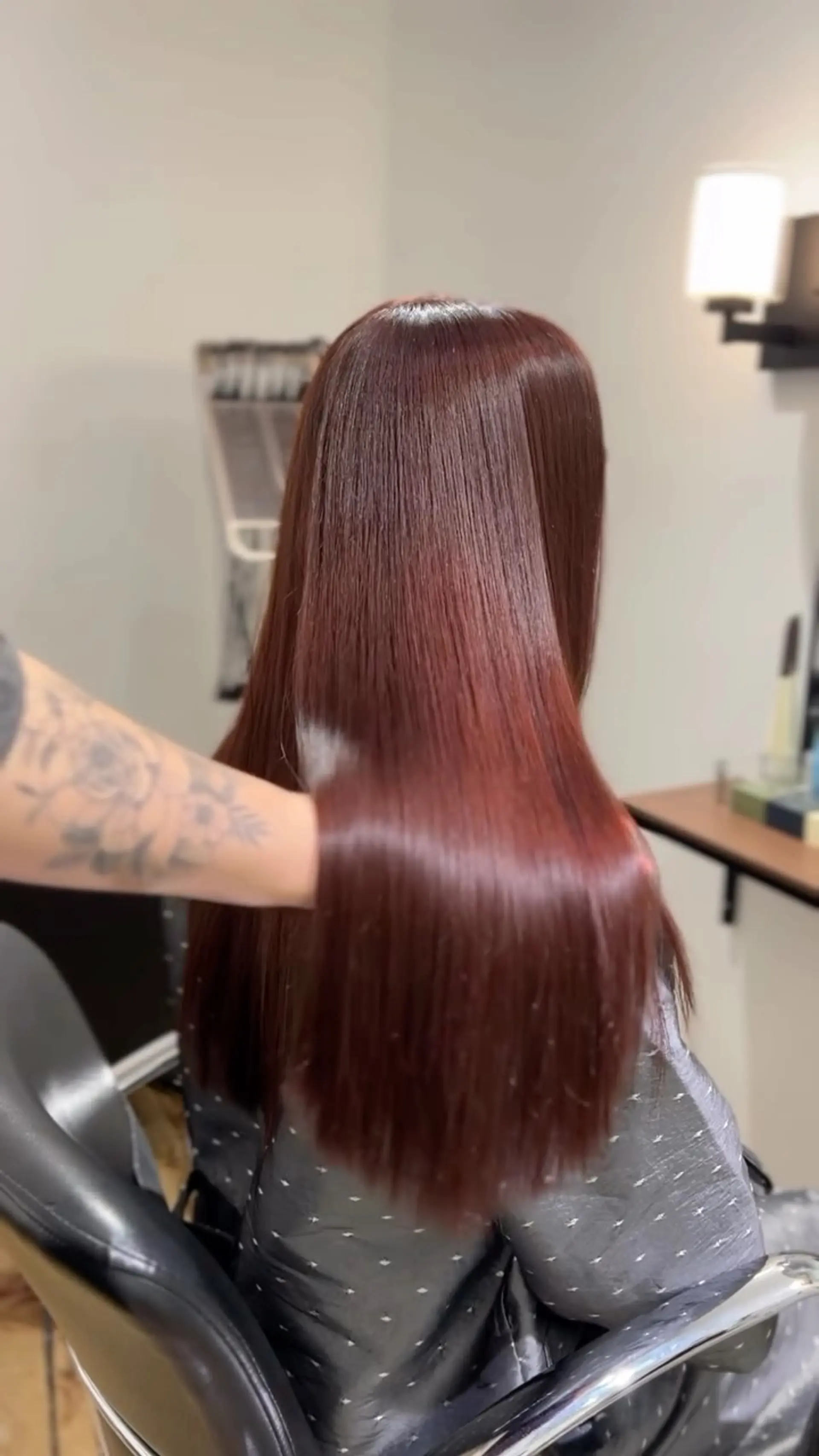 Glossy, long straight hair colored in a vibrant red-brown tone with a silky, glass-like finish. 1