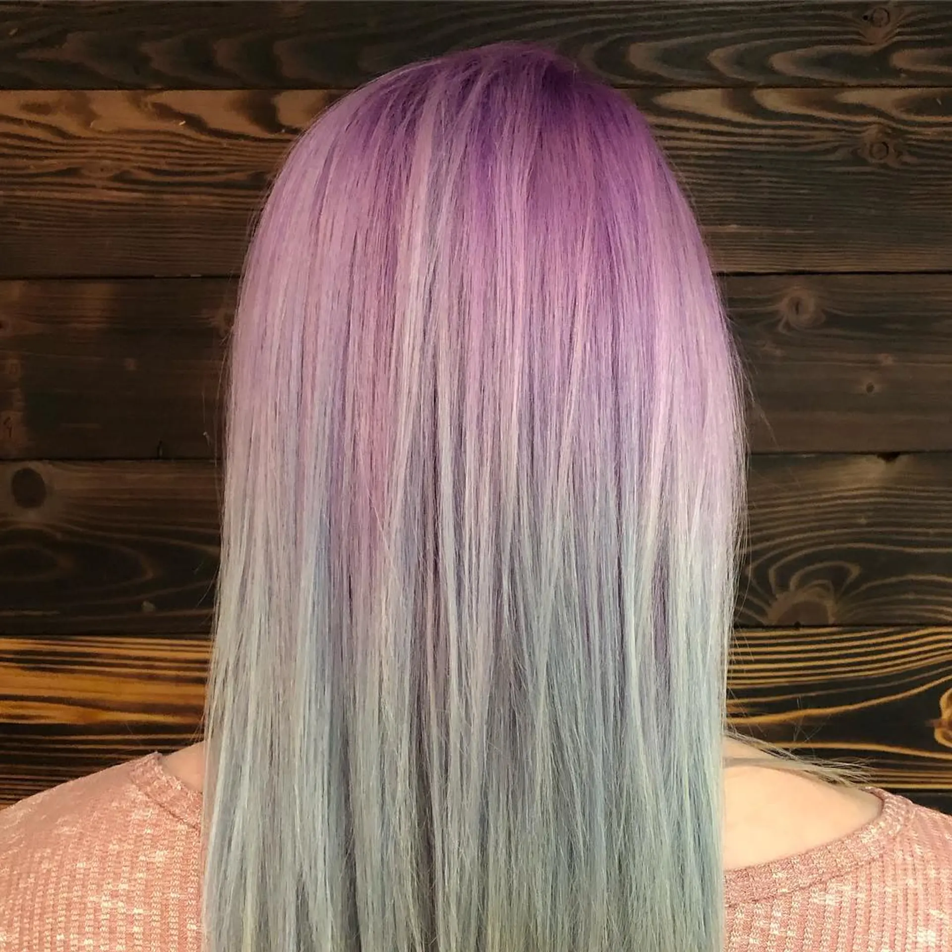 A straight, long hairstyle with a vibrant and trendy pastel color melt. 1