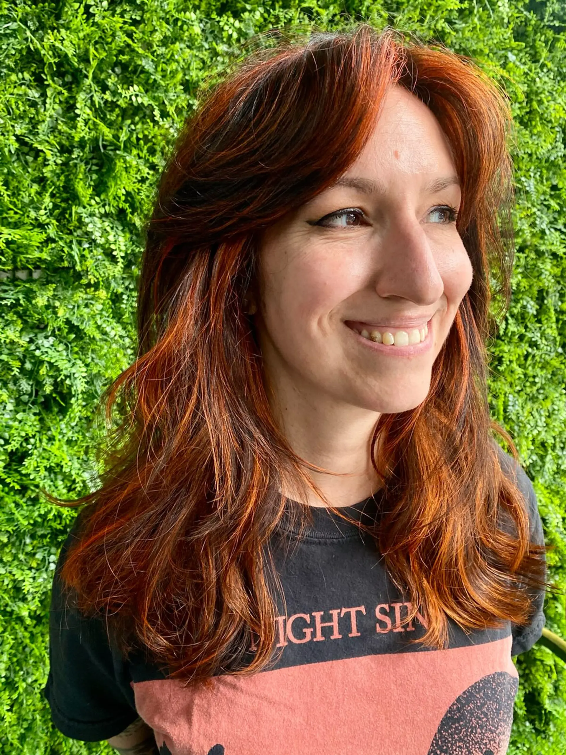 A long, layered haircut with vibrant copper color. 1
