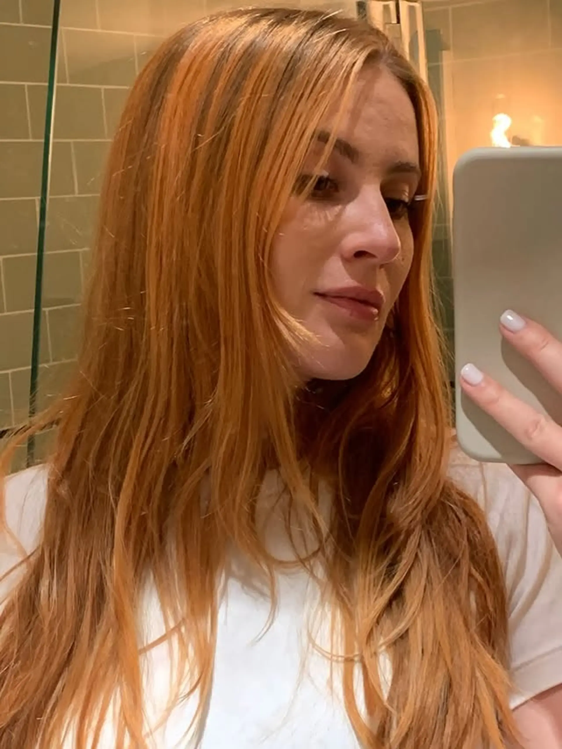 Long layered hairstyle with face-framing layers. 1