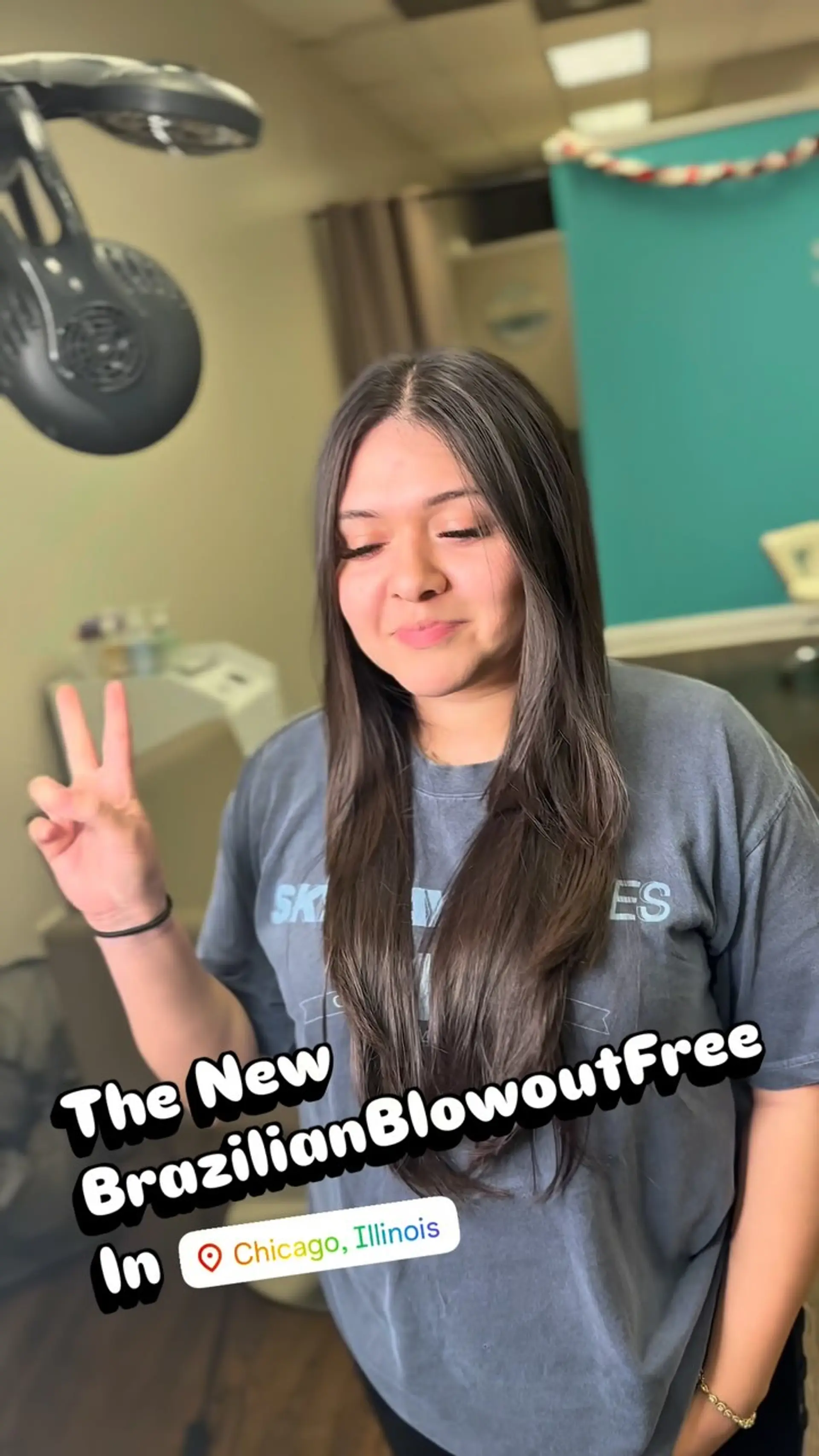 Long, silky dark brown hair straightened with a center part and a glossy, smooth finish. 1