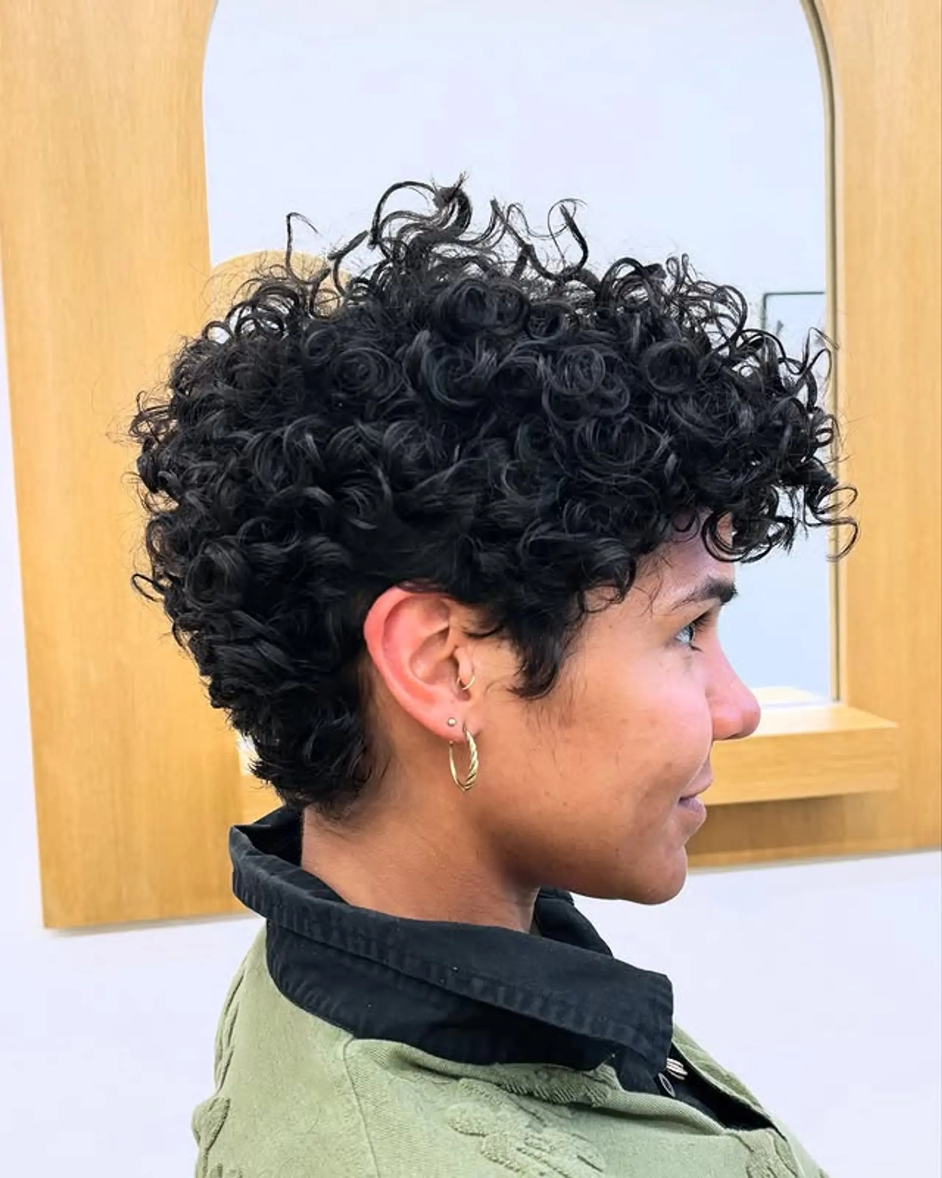 A short pixie cut that accentuates natural curls. 1