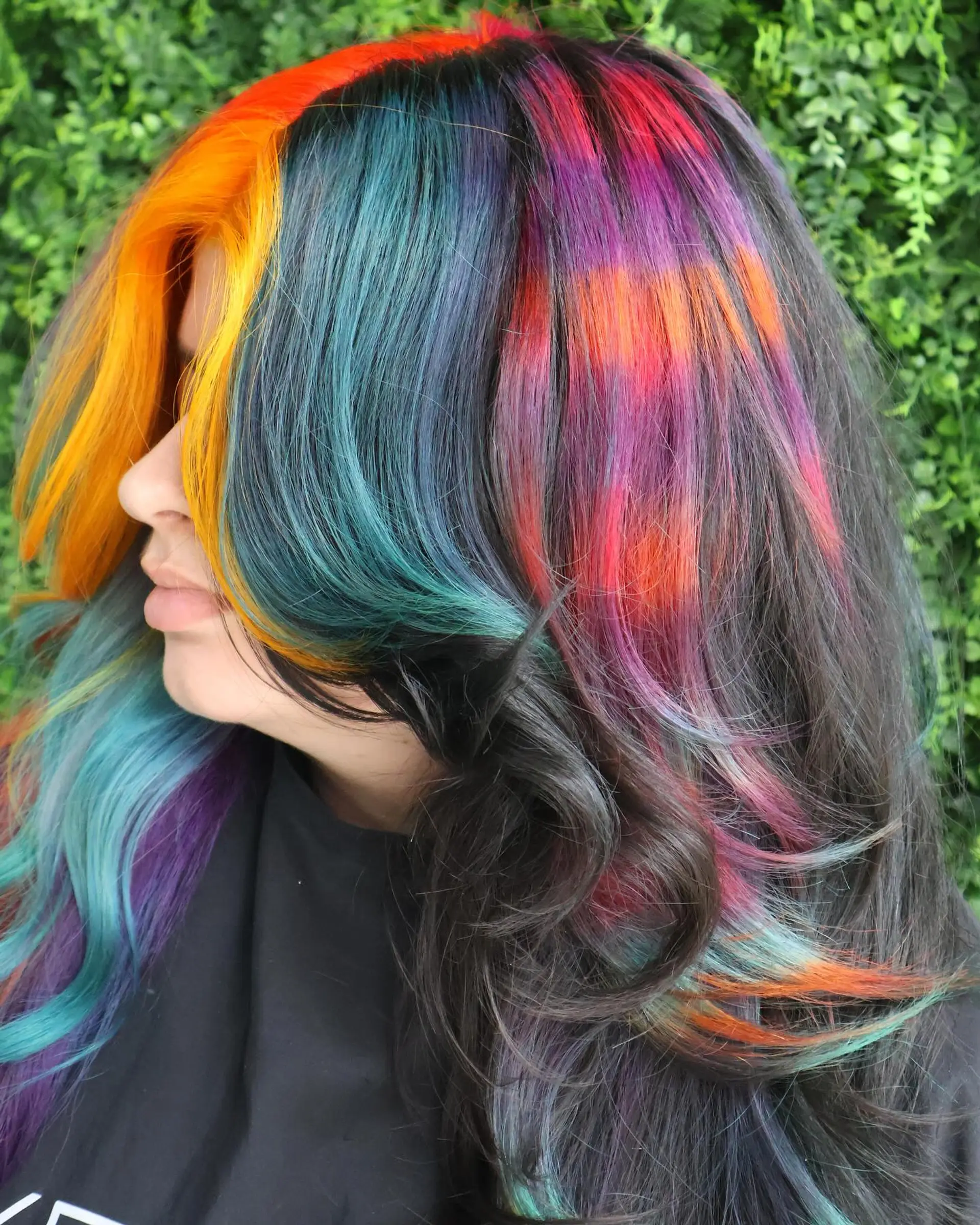 A long, wavy hairstyle with a rainbow balayage effect. 1