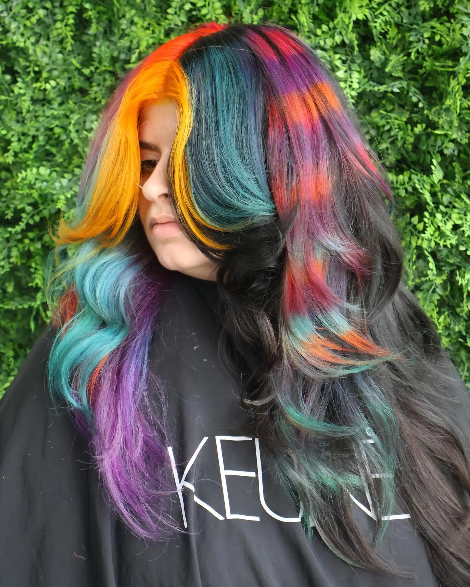 A long, wavy hairstyle with a rainbow balayage effect. 2