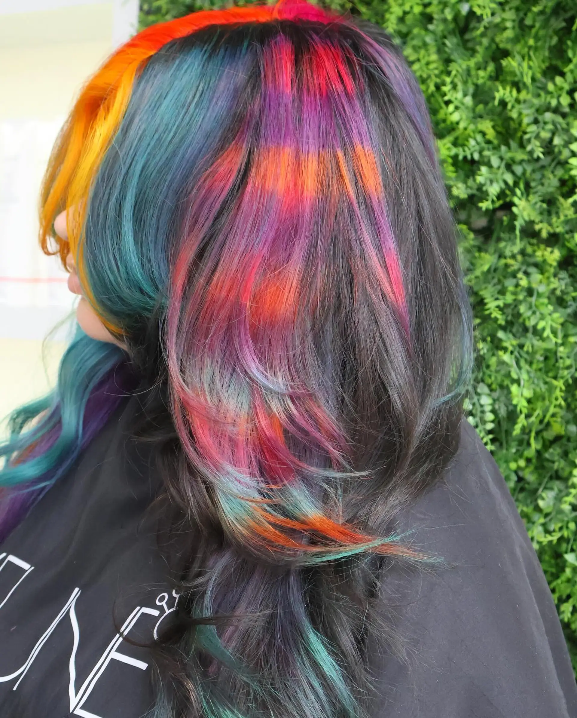 A long, wavy hairstyle with a rainbow balayage effect. 4