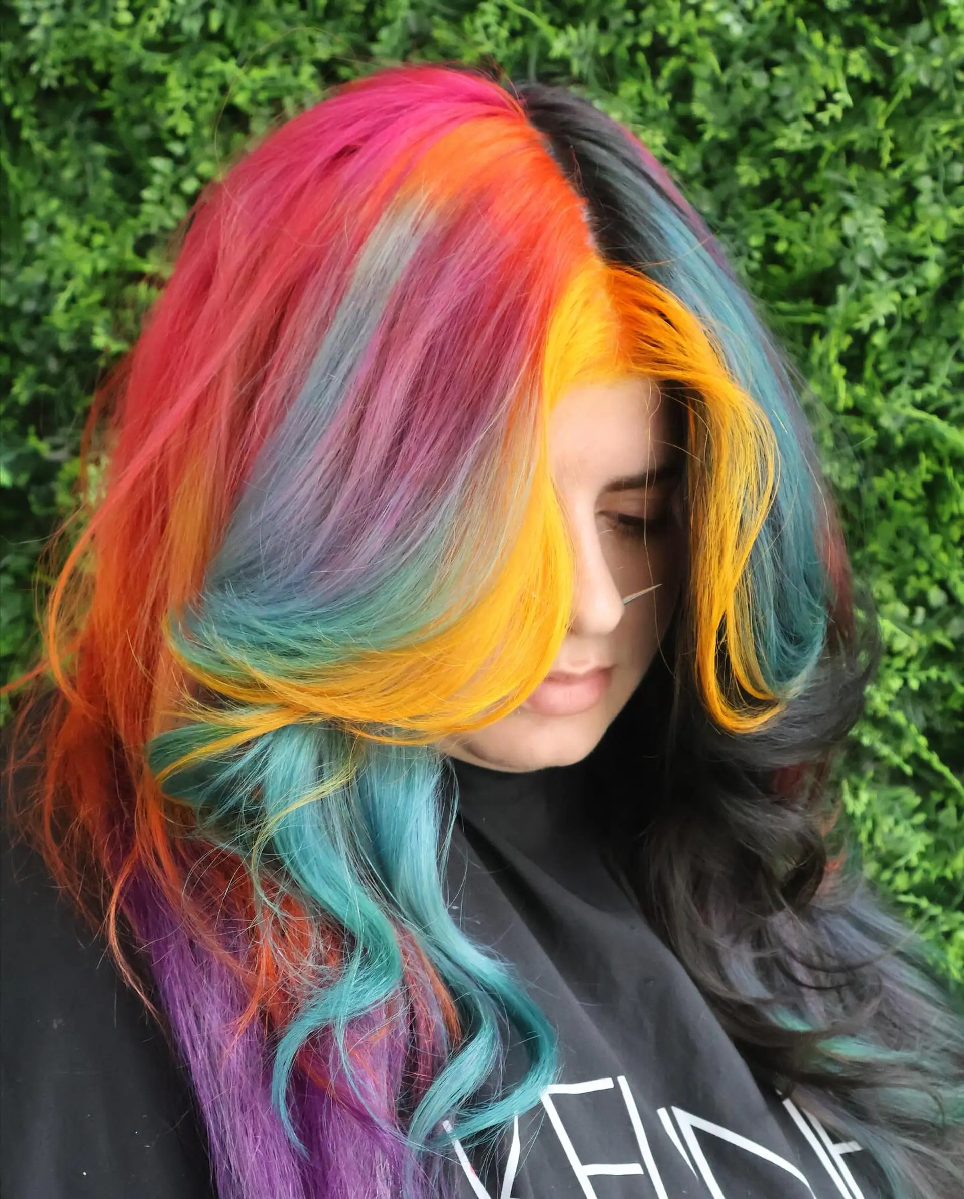 A long, wavy hairstyle with a rainbow balayage effect. 6