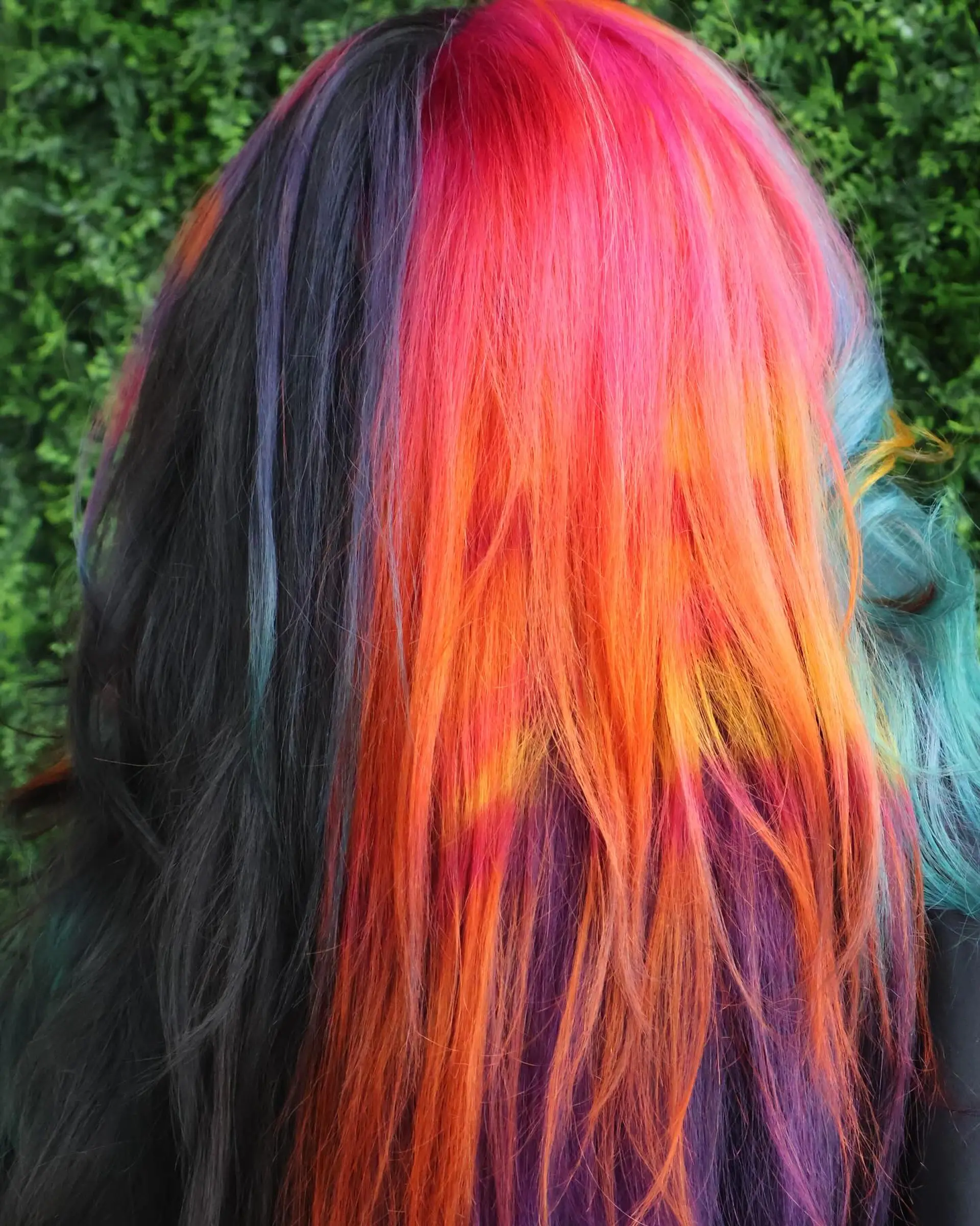 A long, wavy hairstyle with a rainbow balayage effect. 7