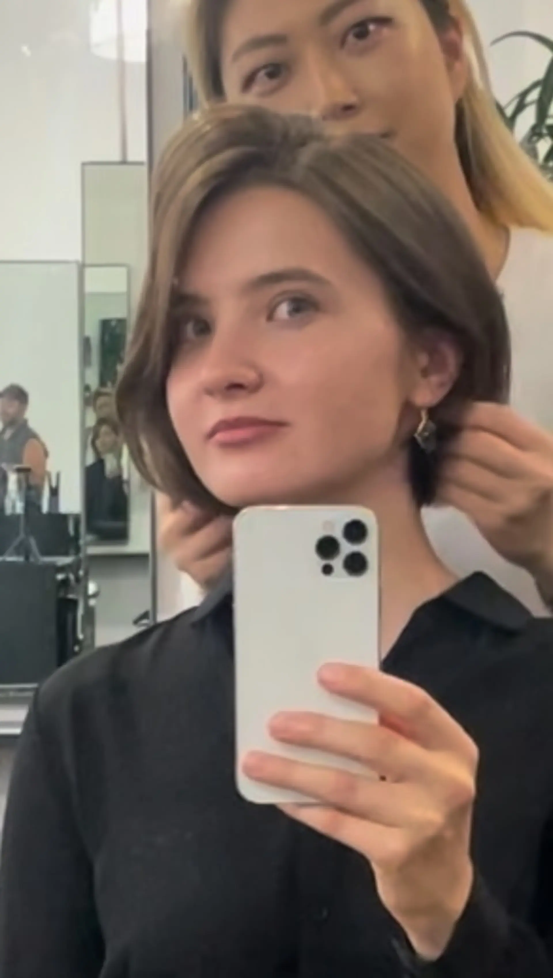 A sleek jaw-length bob haircut with natural volume, a side part, and clean tapered ends. 1