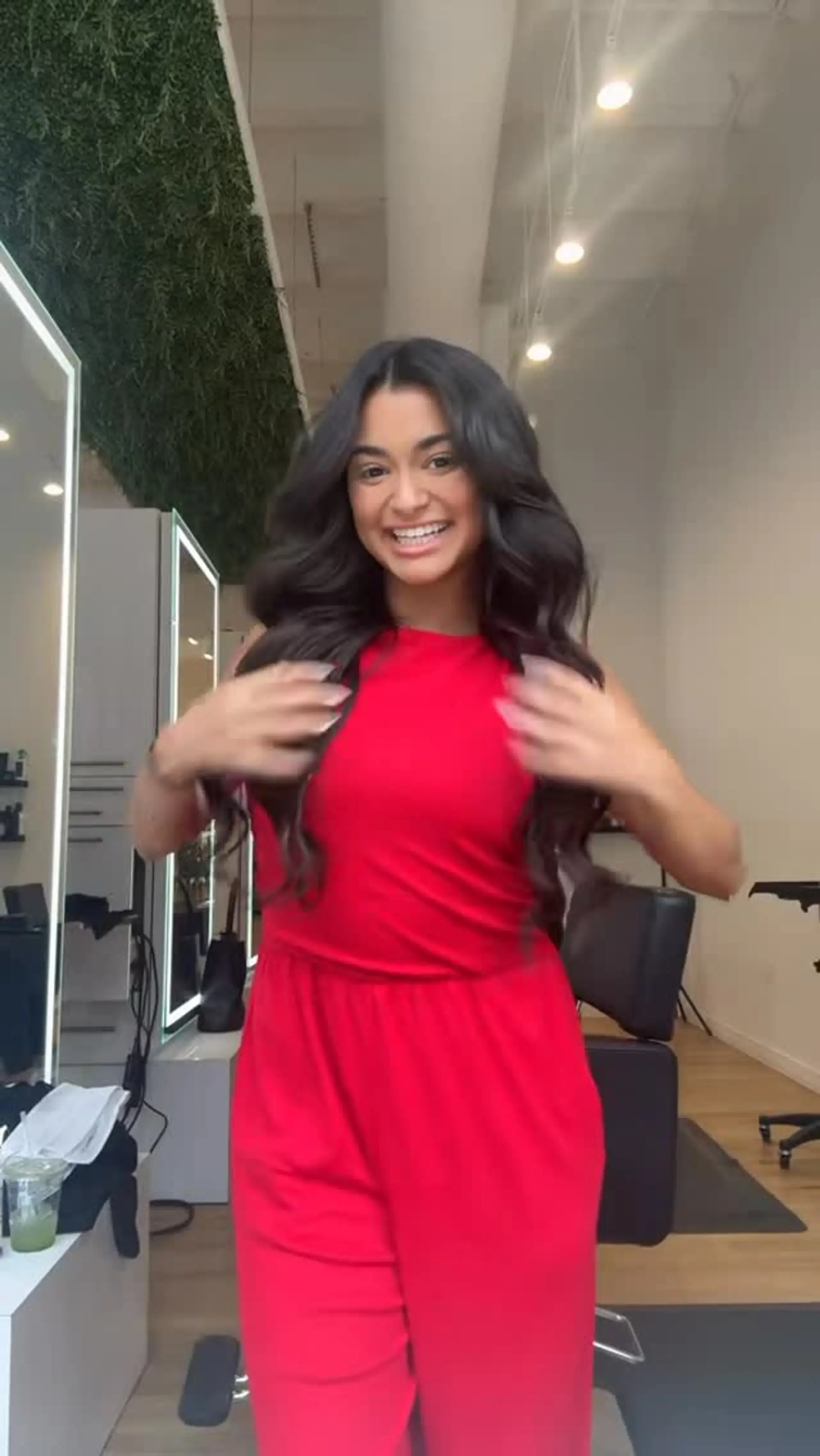 Long dark brown hair styled with voluminous, soft body waves and a middle part. 1