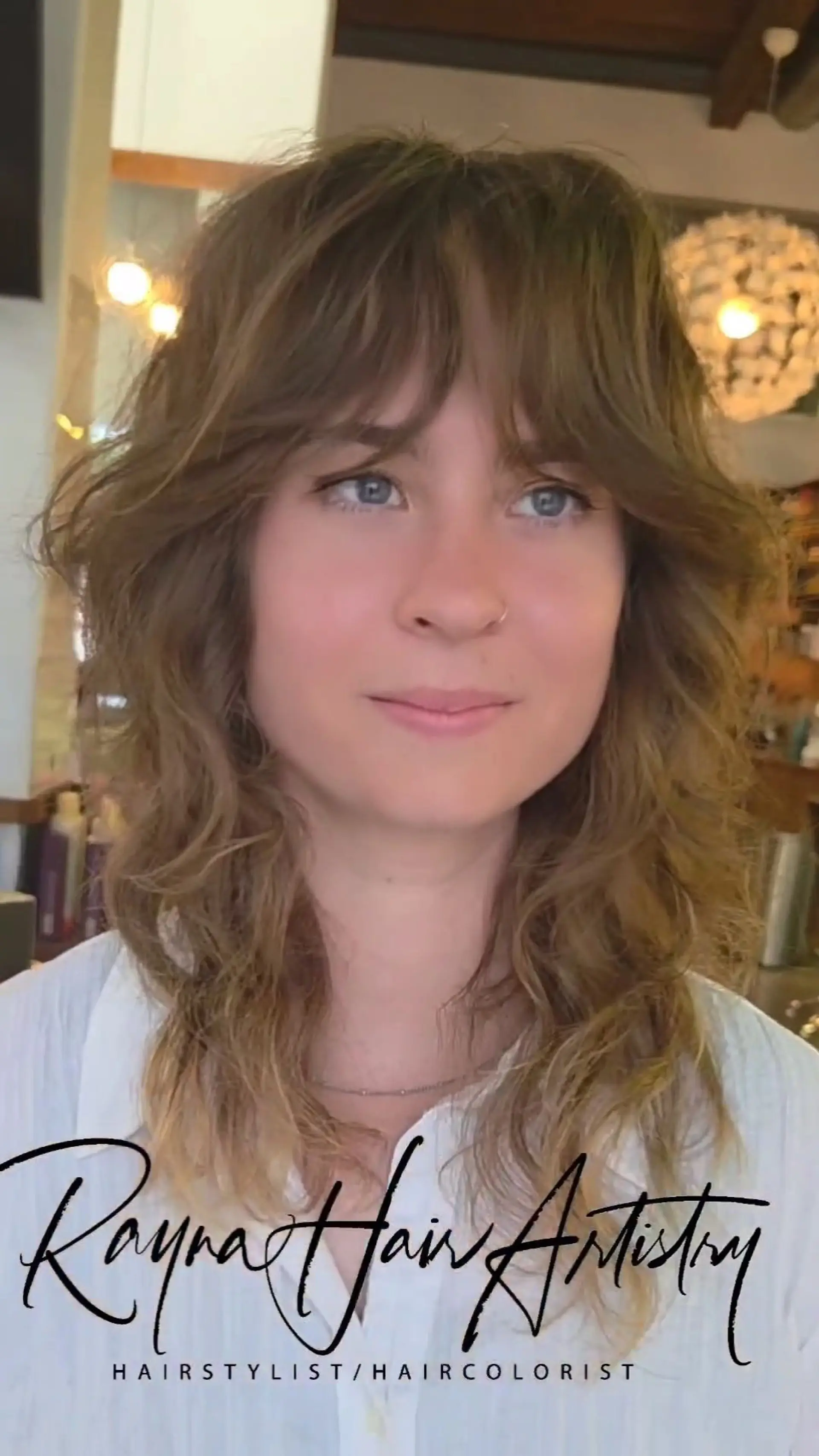 A layered retro shag haircut featuring soft curtain bangs and textured, face-framing waves. 1
