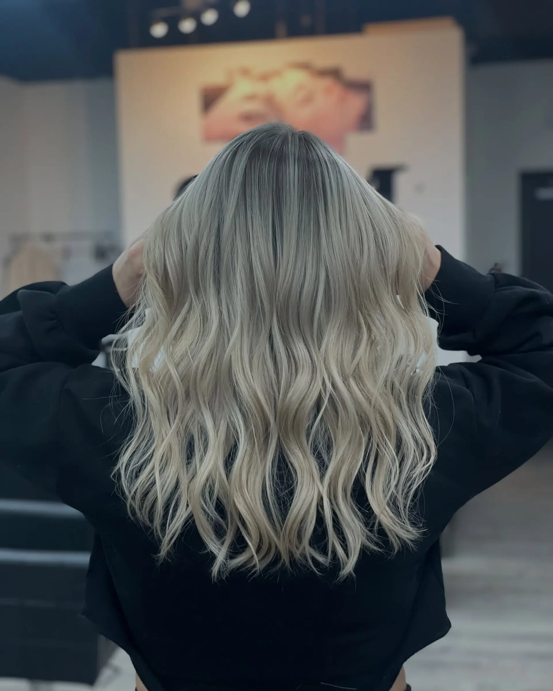 Long, wavy hairstyle with loose, natural waves. 1