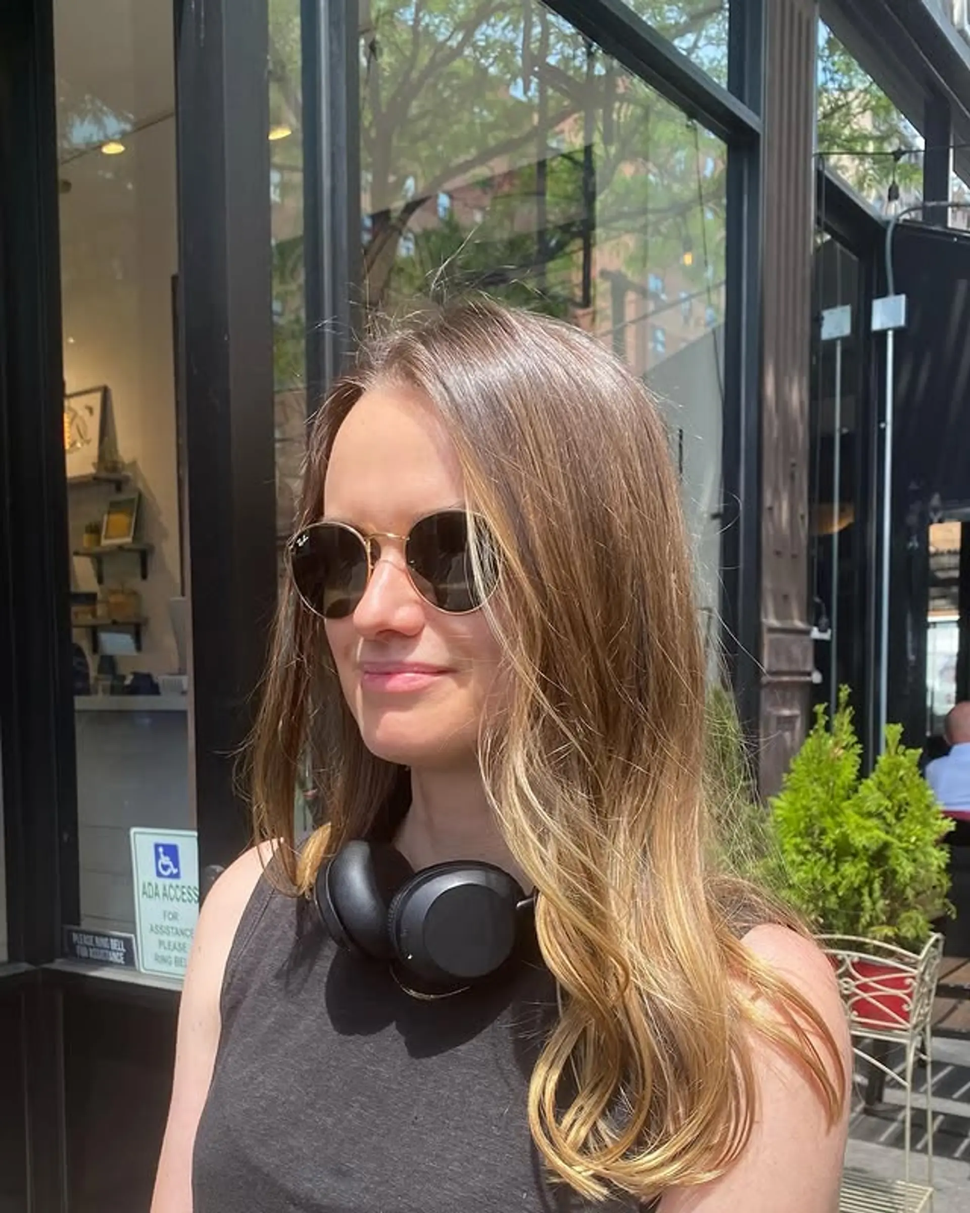 A long, wavy ombre hairstyle that transitions from brown to golden blonde. 1