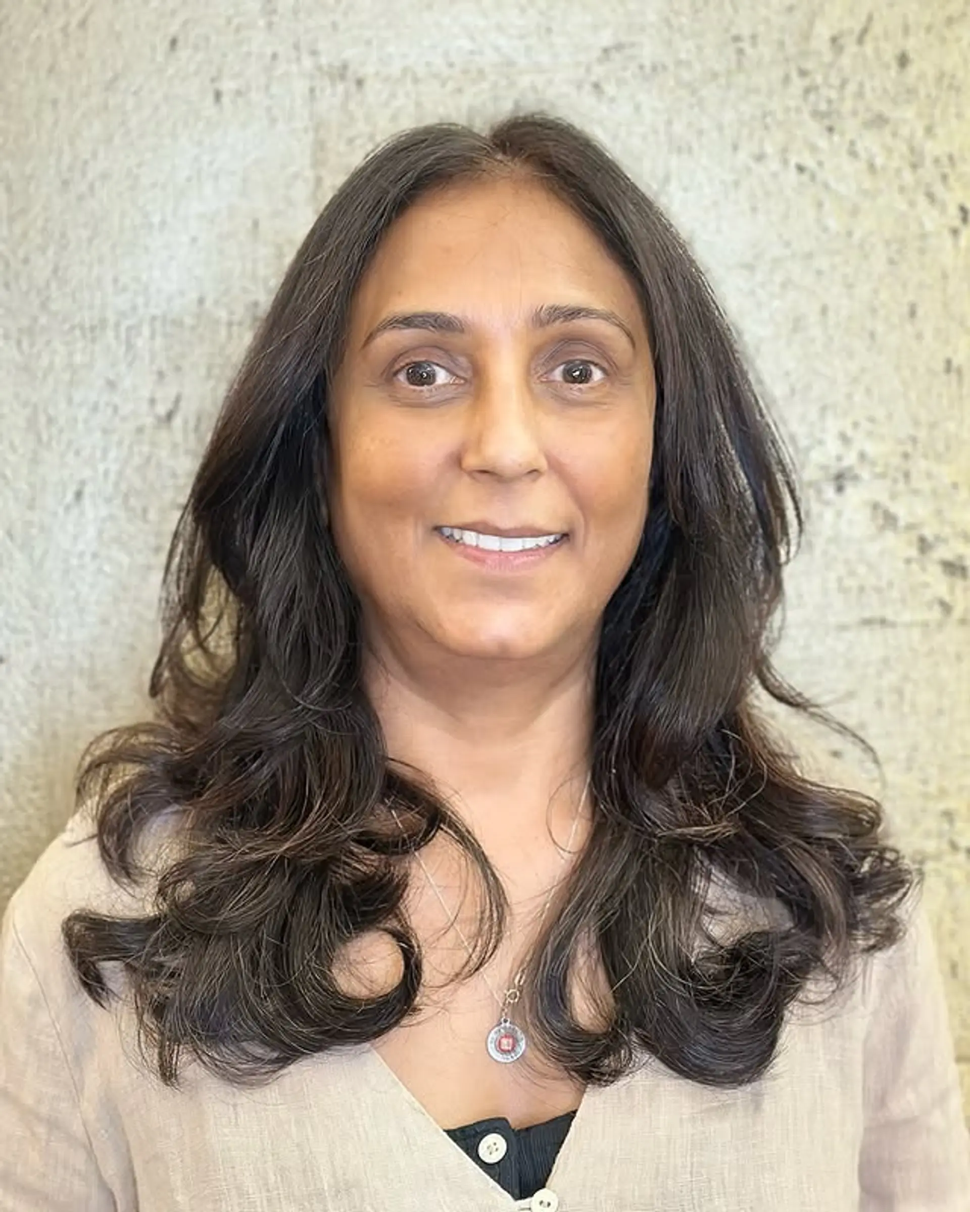 A long layered haircut with soft waves. 1