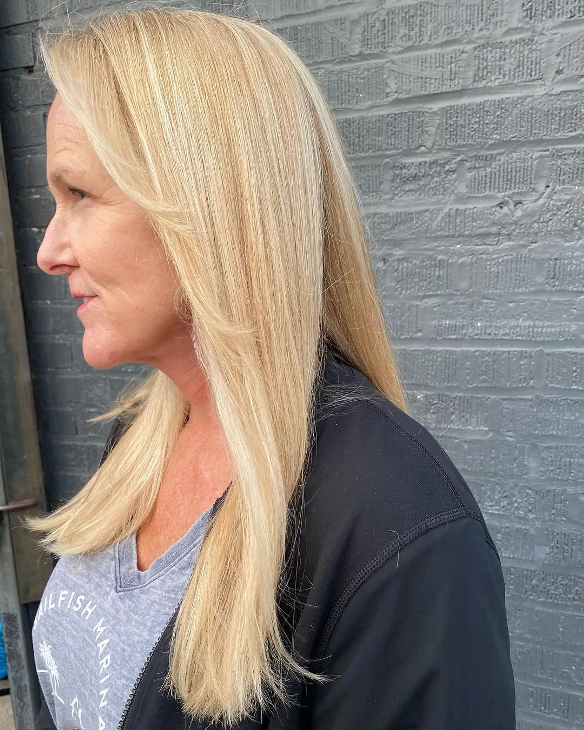 Long, straight blonde hair with a side part and sleek, smooth strands. 1