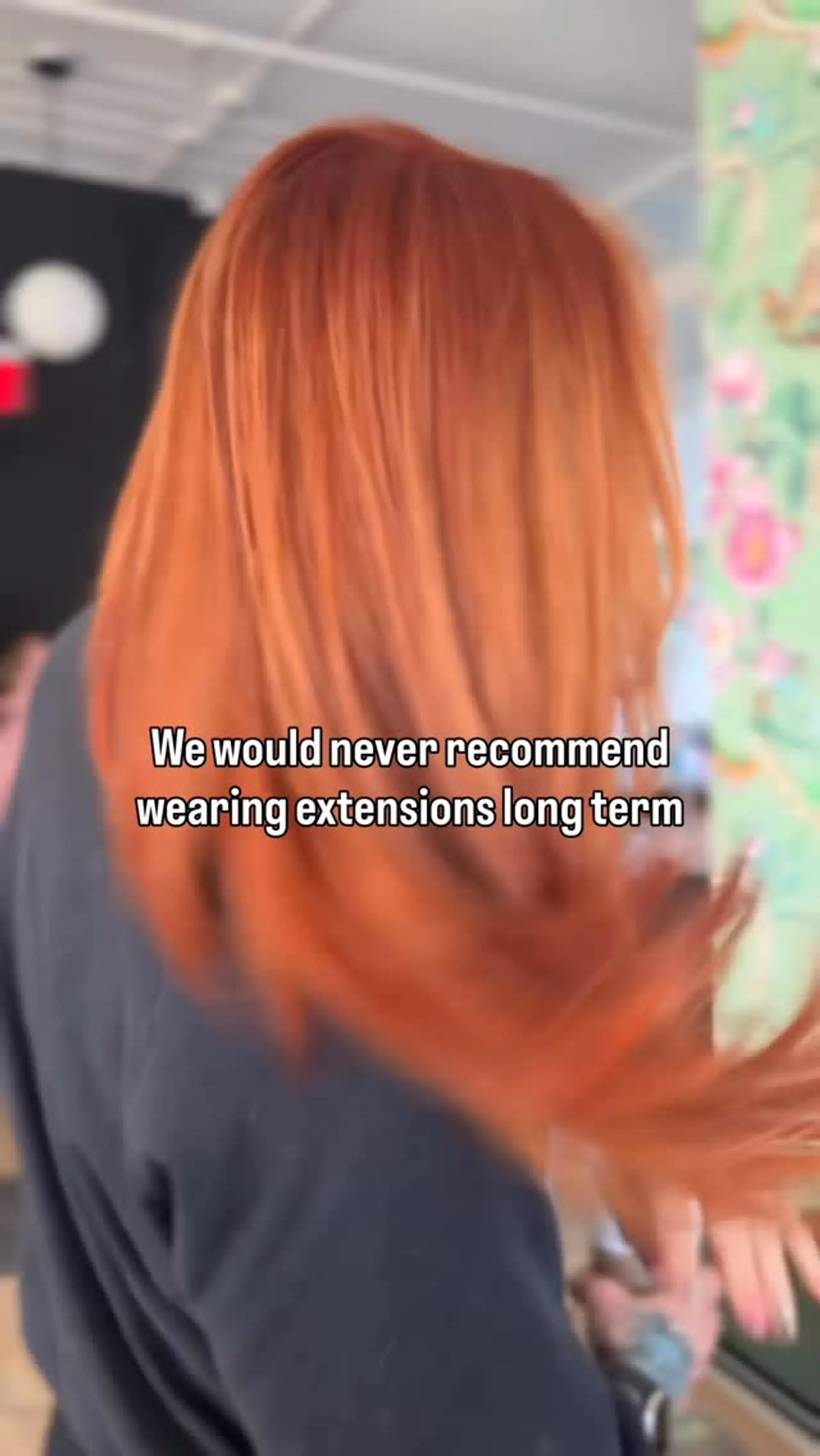 A dimensional copper red hair color styled with a smooth, dynamic blowout. 1