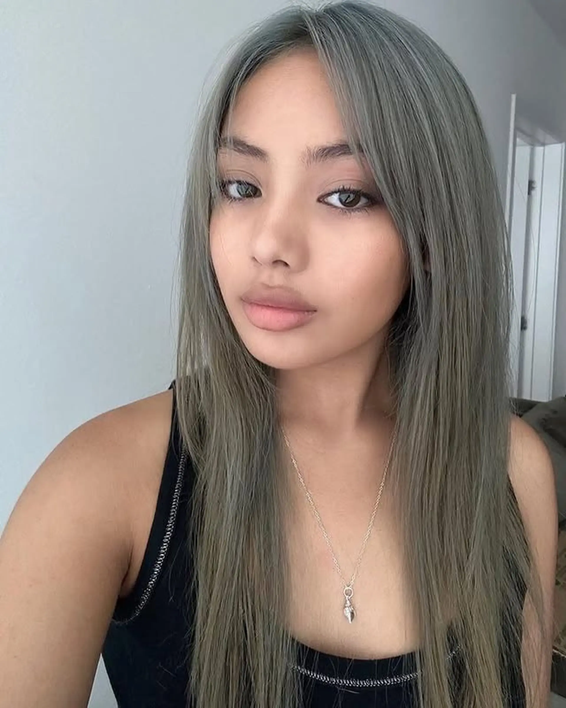 Long, layered straight hair with face-framing bangs. 1