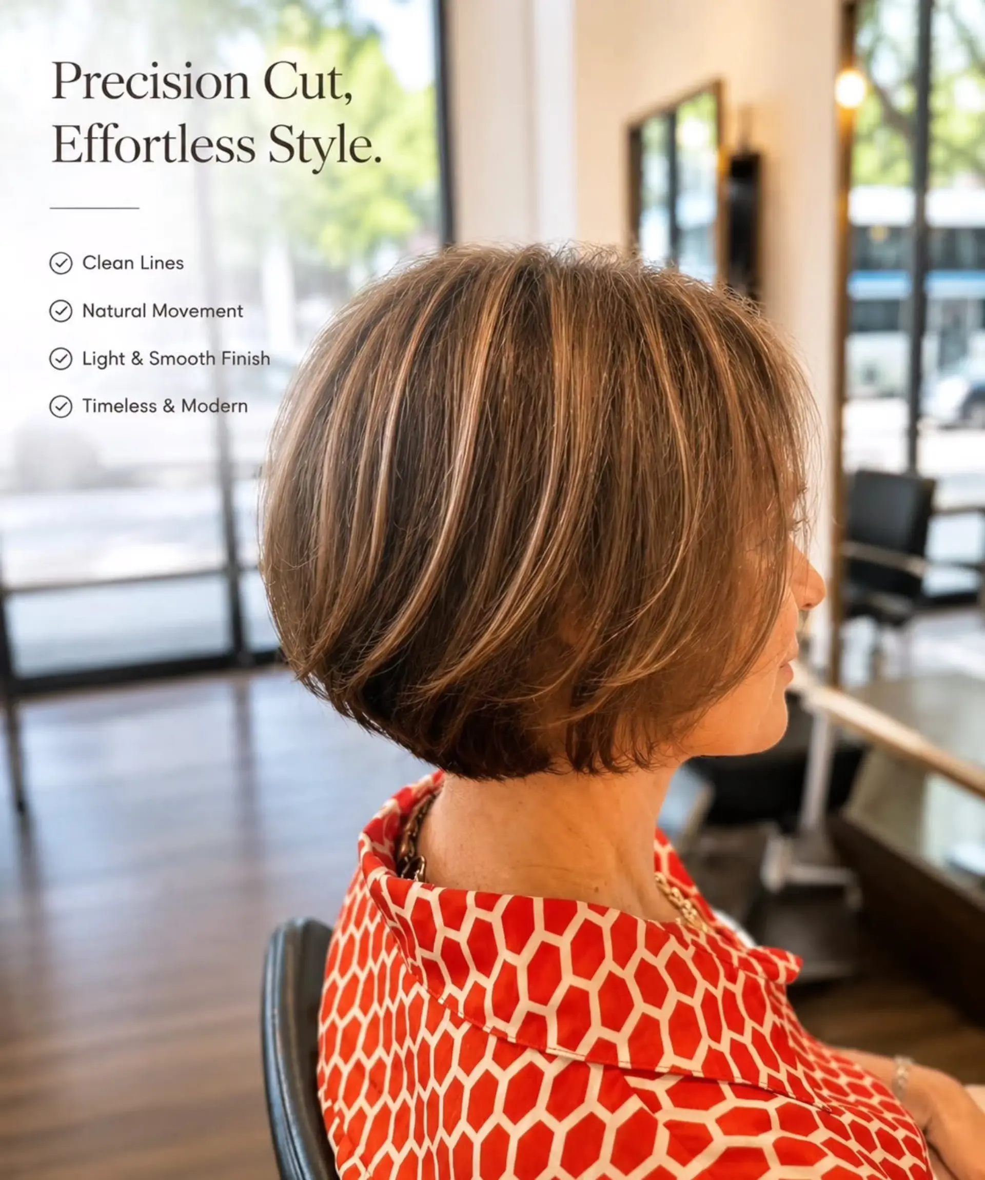 A sleek, chin-length layered bob with rounded fullness and fine dimensional blonde highlights. 1