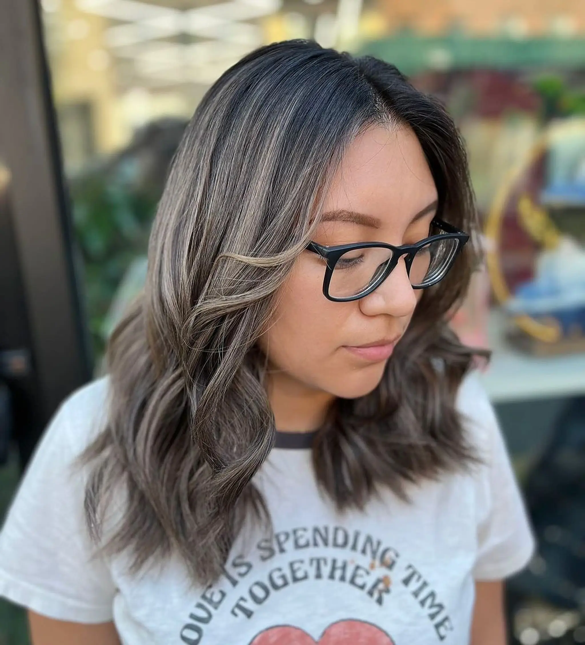 Medium-length, wavy dark brown hair with subtle balayage highlights and face-framing highlights.
Stylist - @xcellent_jason