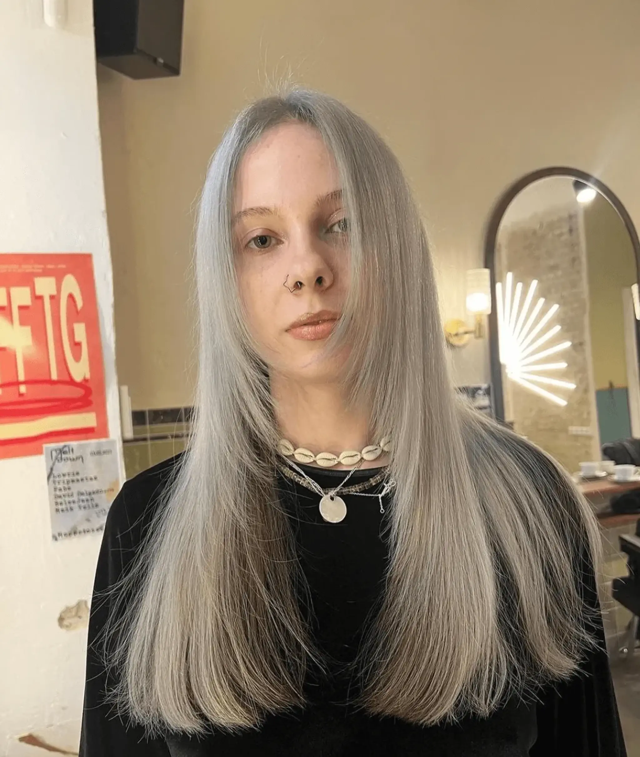 Long, straight, and smooth silver hair with a center part and subtly layered ends for added dimension.