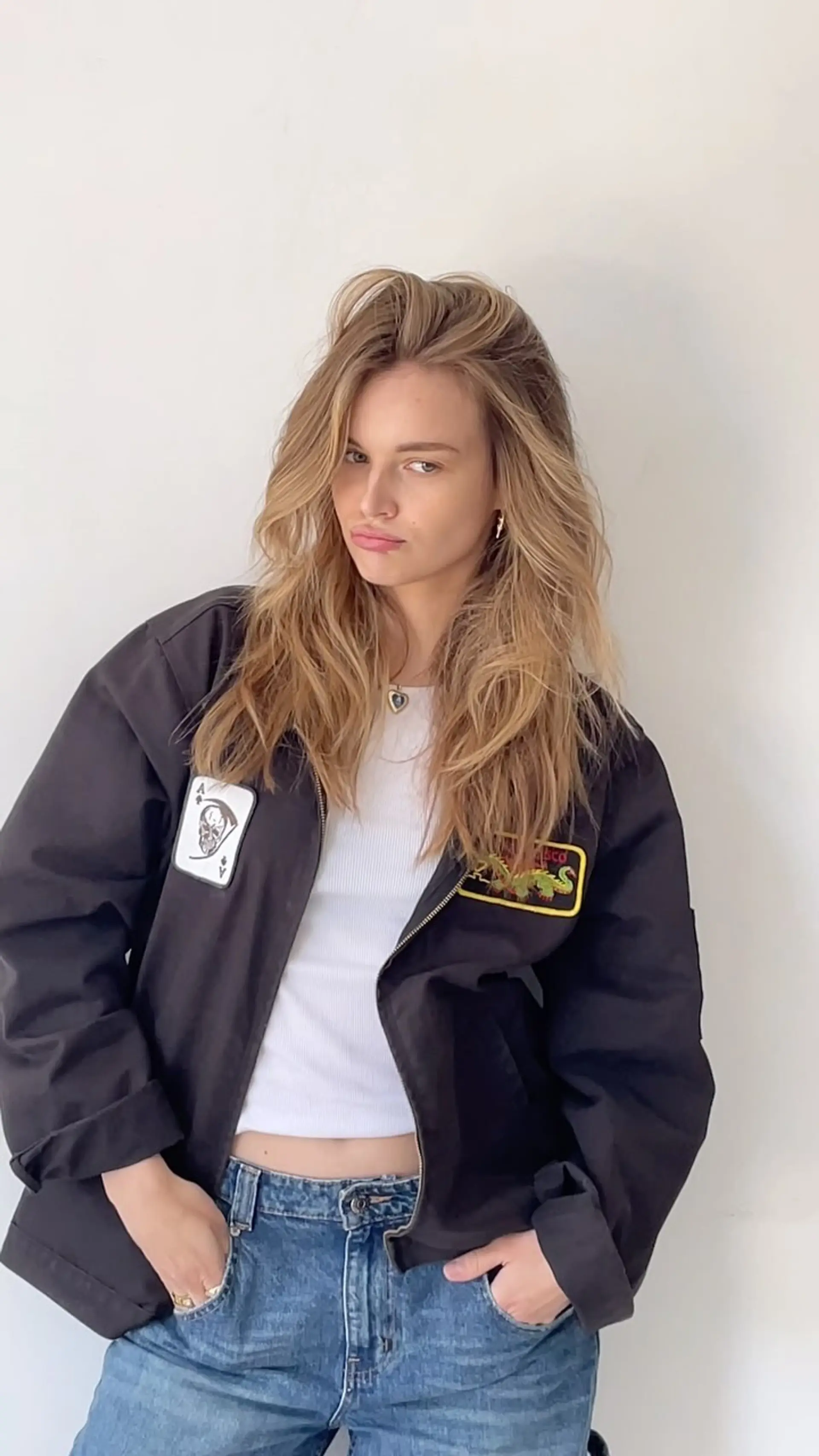 Tousled, voluminous long hair with face-framing layers and soft warm blonde highlights. 1