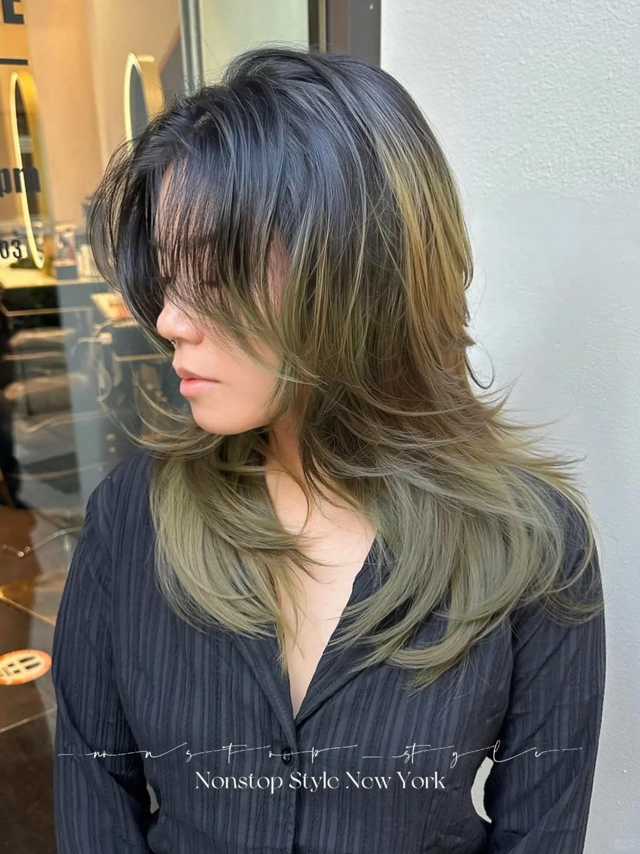 A medium-length wavy hairstyle with intricate layers and feathered ends, featuring a blend of black, ash blonde, and olive green tones.

(NonstopStyle: by Hiro)