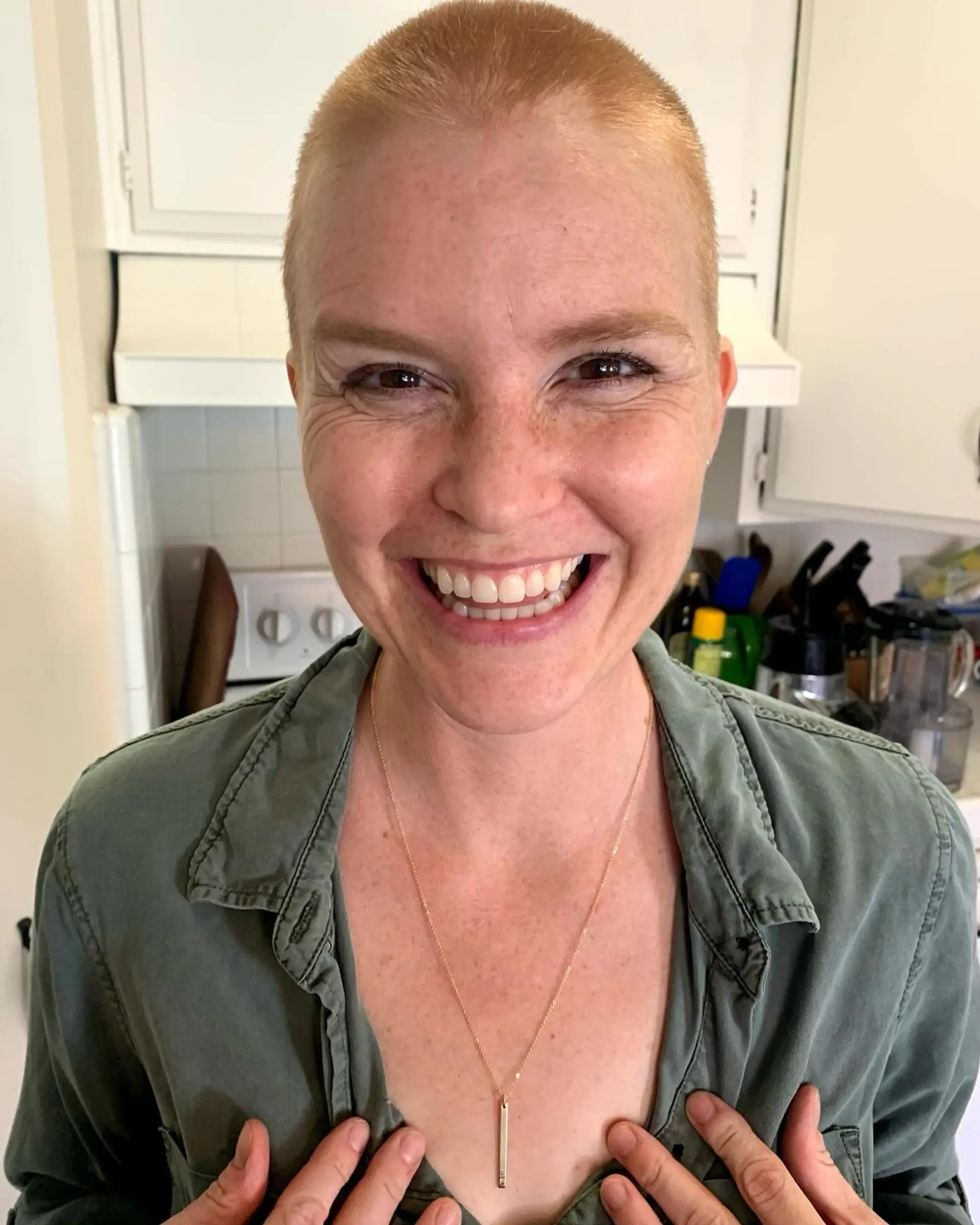 An ultra-short, uniform clipper buzz cut across the entire head. 1