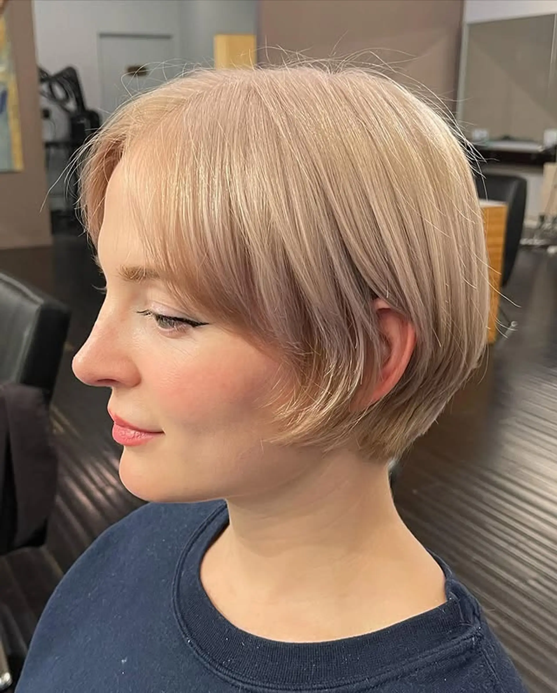A chic, chin-length bob with blunt bangs and a sleek finish. 1
