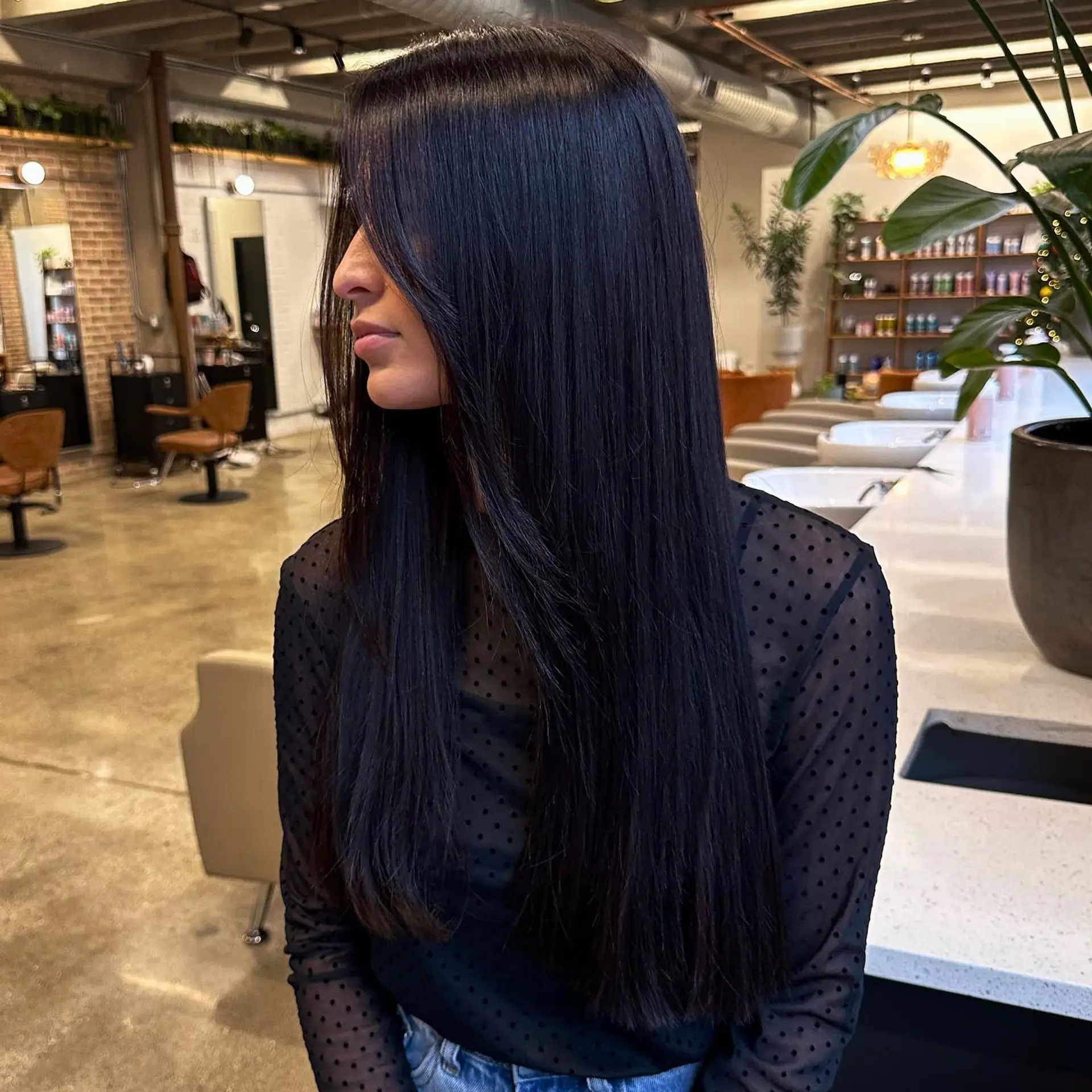 This is a sleek, straight, long hairstyle. The cut is one length and modern. 1