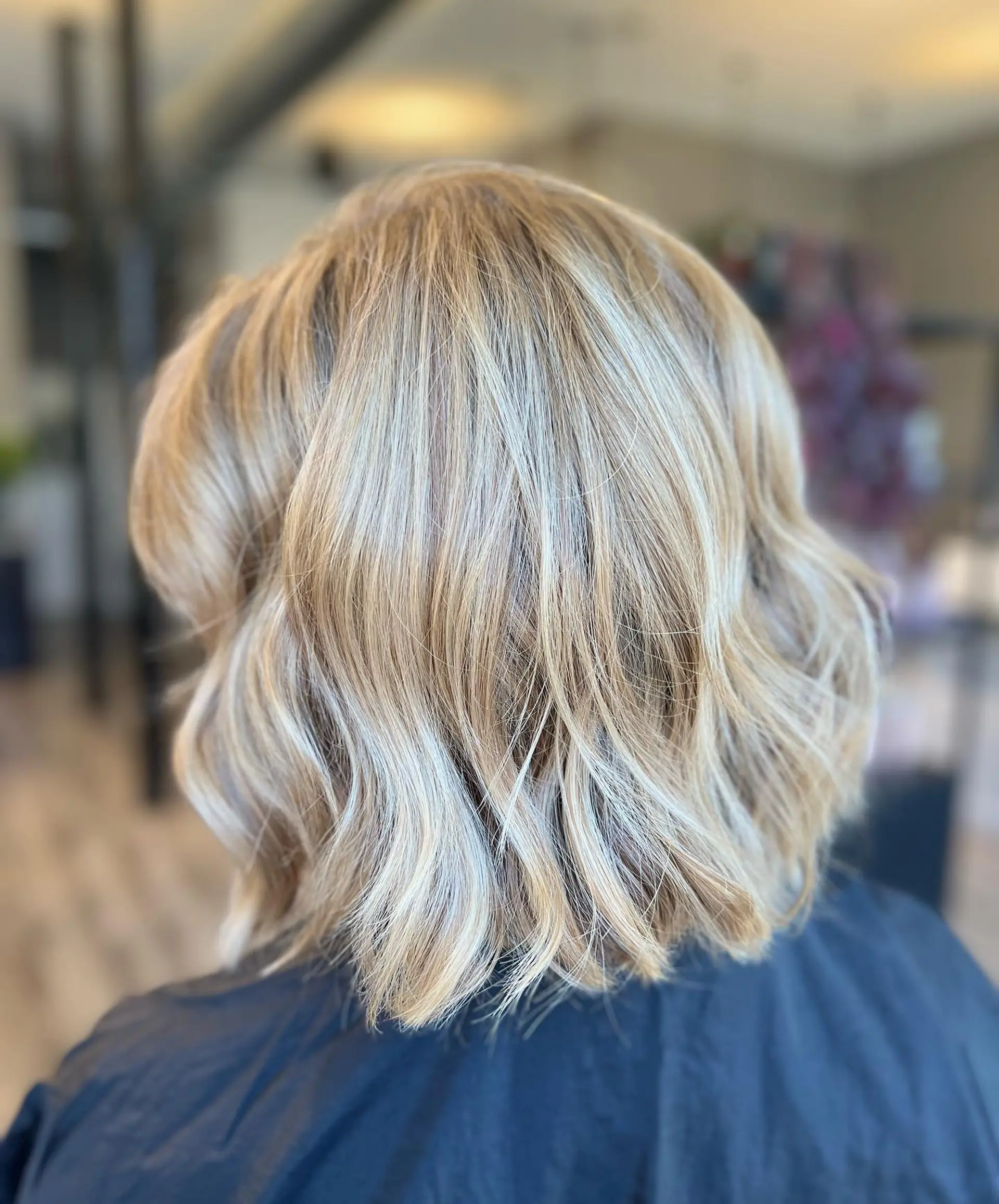 A wavy bob with subtle babylights for added dimension and a beachy vibe. 1