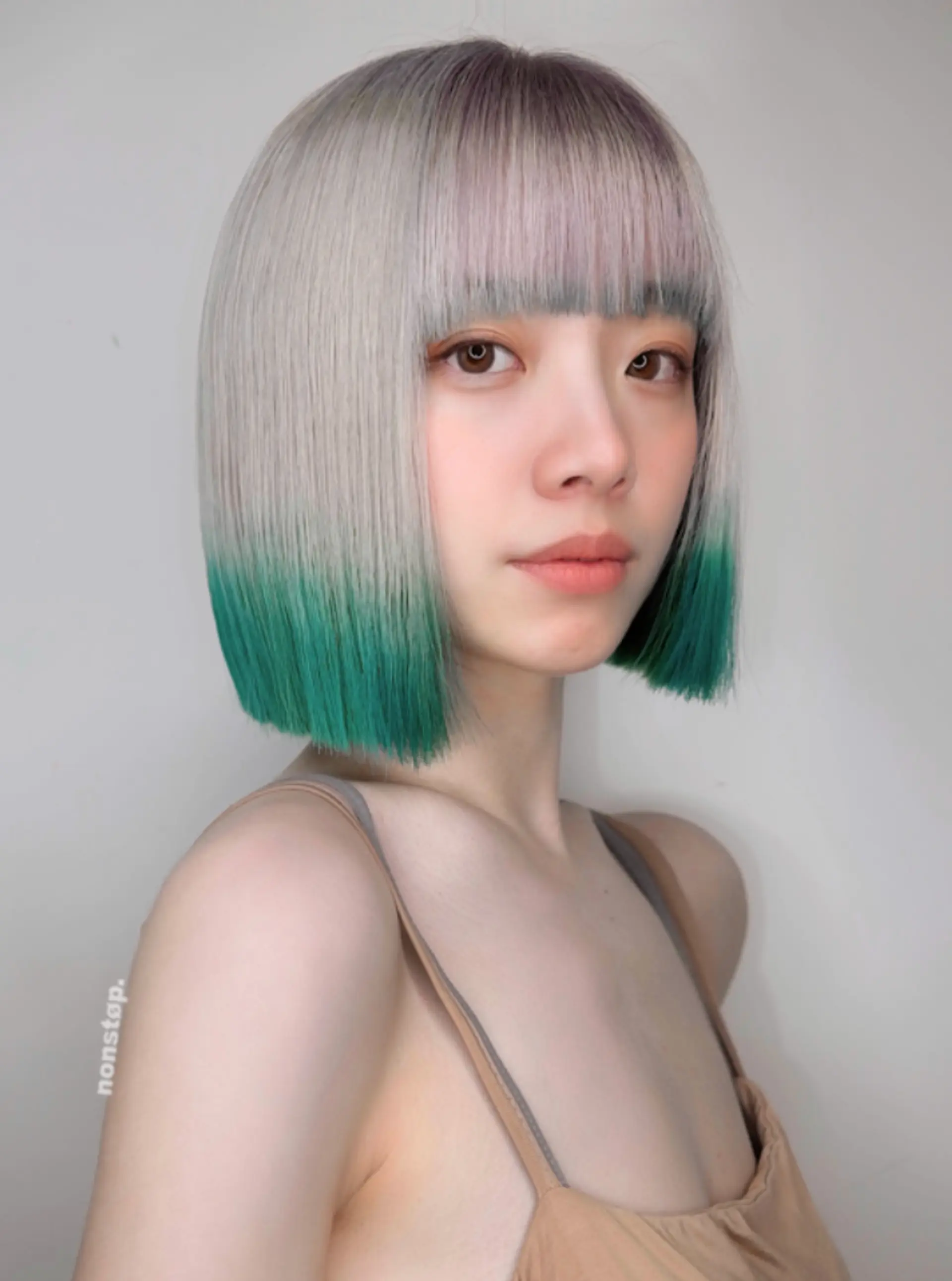 A sleek, straight bob cut with a striking silver base that transitions into vibrant teal tips, creating an ombre gradient effect.
(NonstopStyle: by Hiro) 3